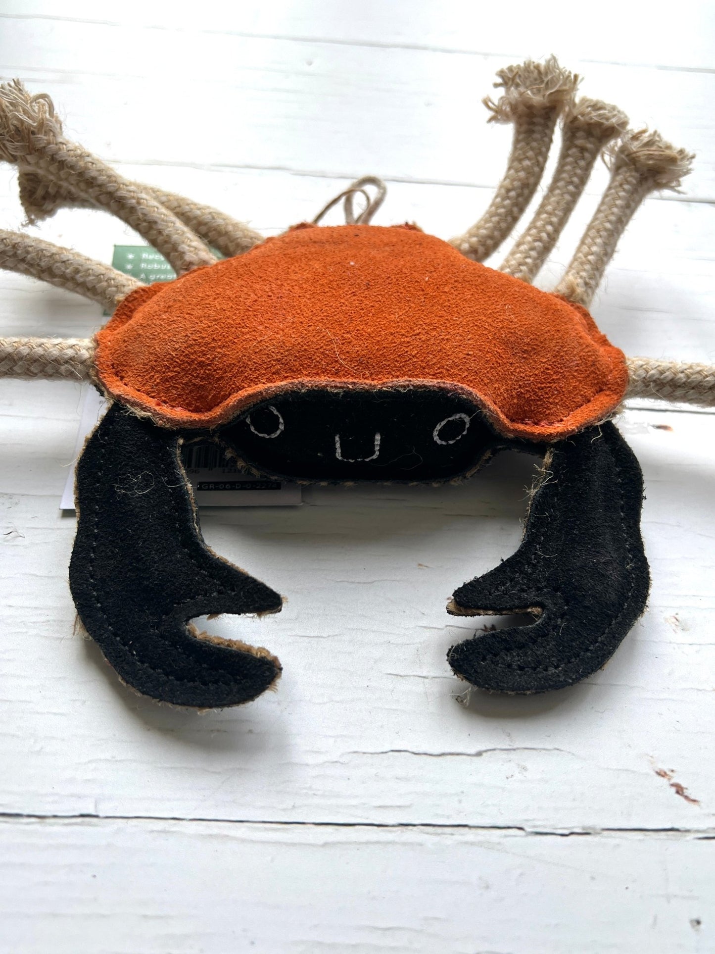 orange and black felt crab eco dog toy with rope legs - handmade sustainable pet toy with embroidered face