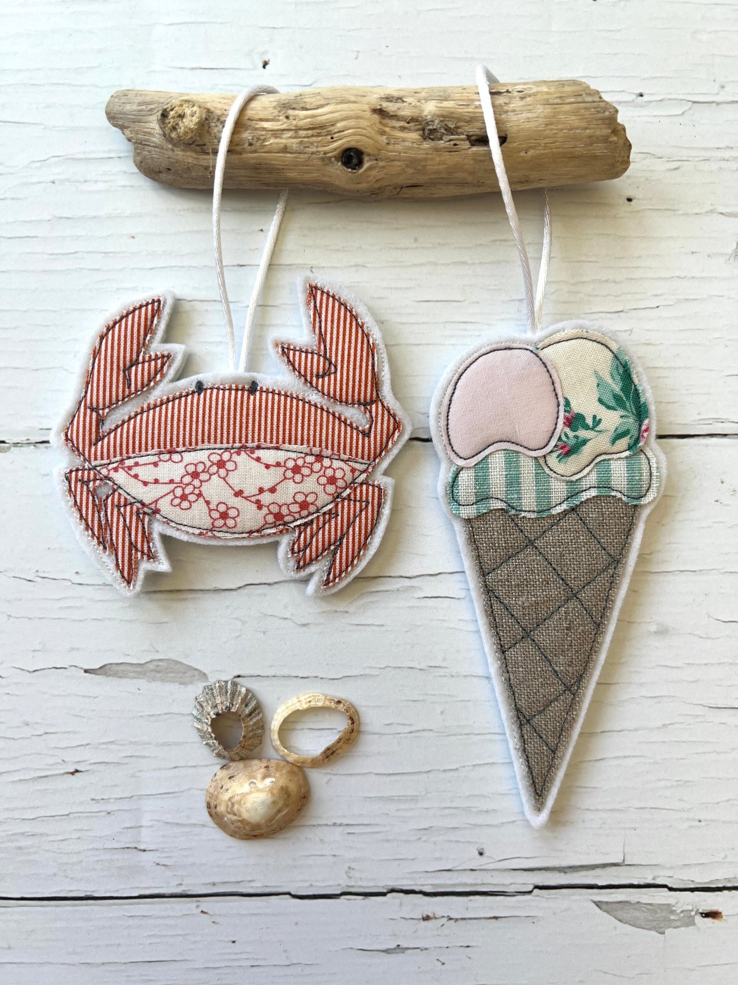 coastal fabric ornaments, crab ice cream cone charms, driftwood display, beach themed handmade decorations, nautical hanging art