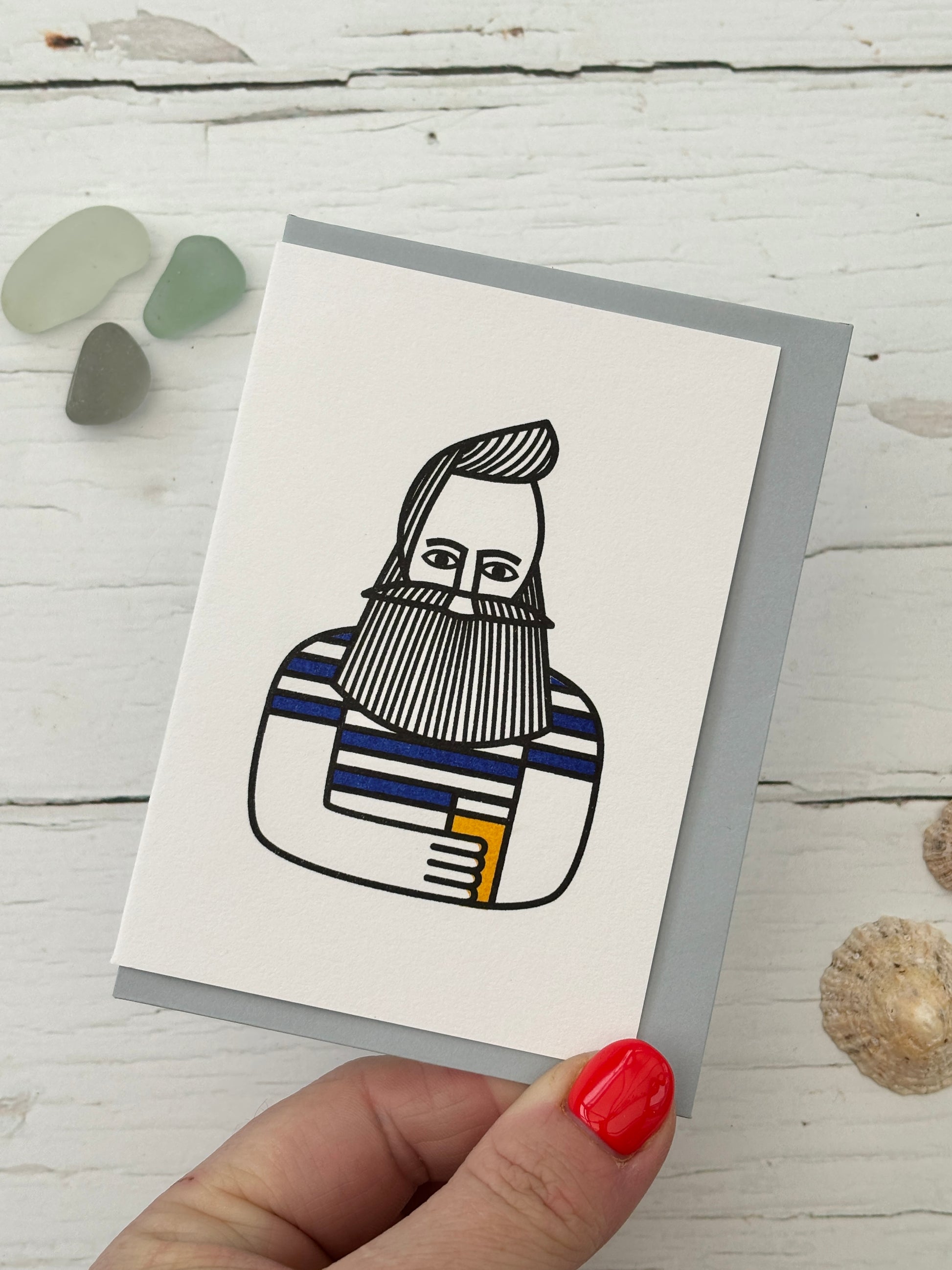 illustrated bearded man greeting card, striped shirt blue accents, quirky nautical character design, coastal stationery