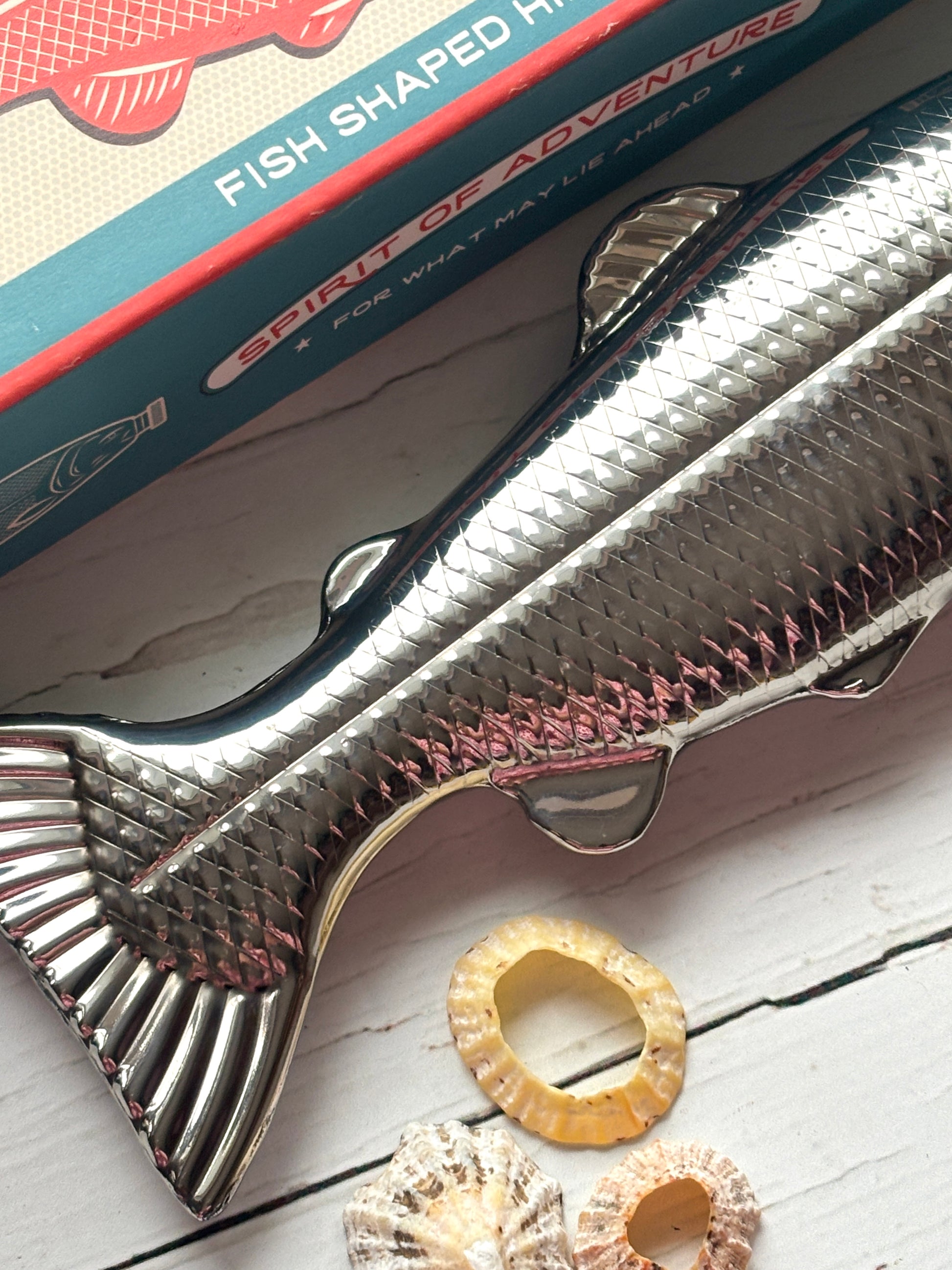 fish-shaped hip flask with detailed fin and scale texture, stainless steel novelty bottle with retro gift box