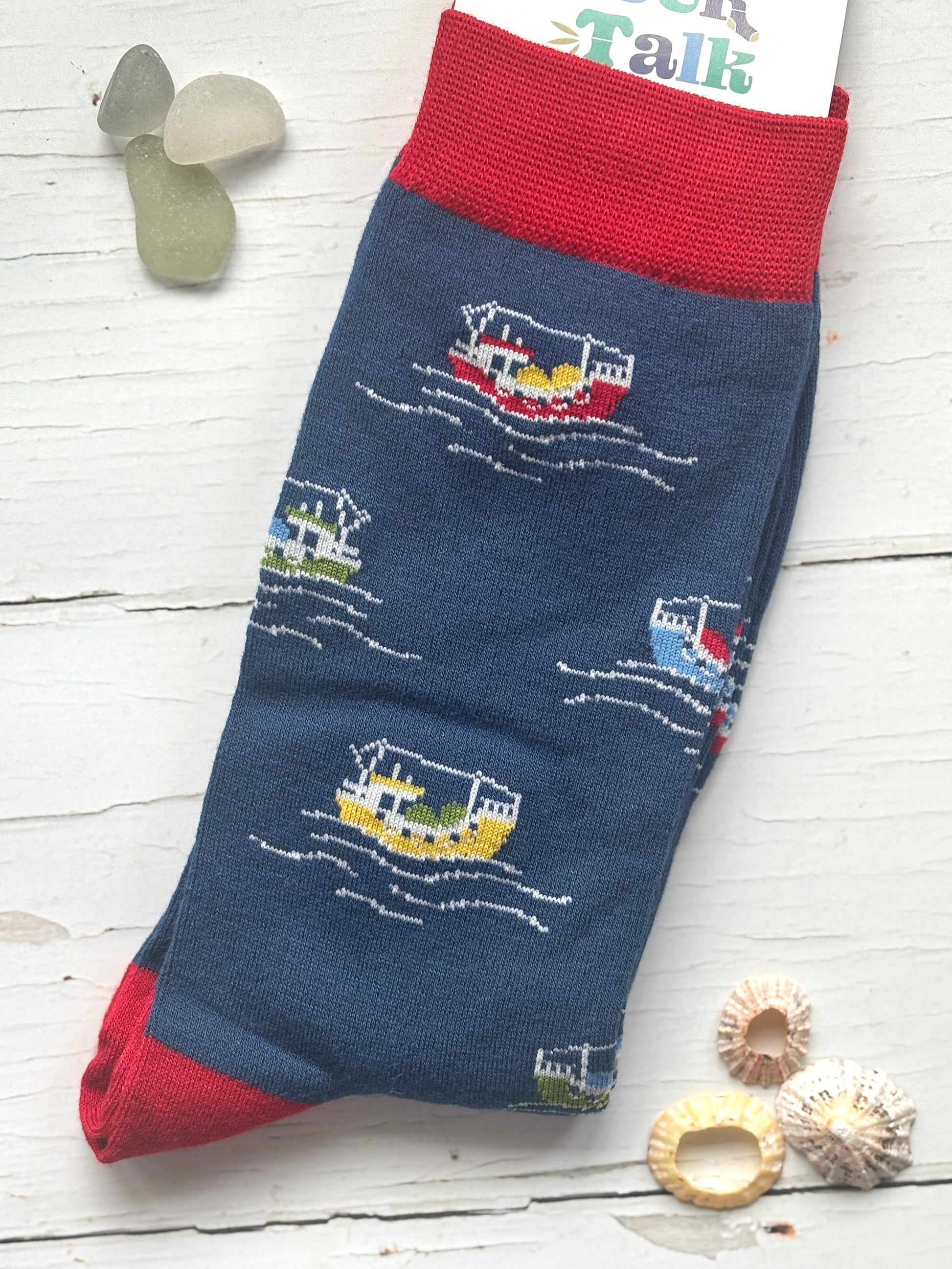 fishing boat men’s socks—vibrant boat and wave print on navy bamboo fabric with red accents, perfect for nautical gifting and style