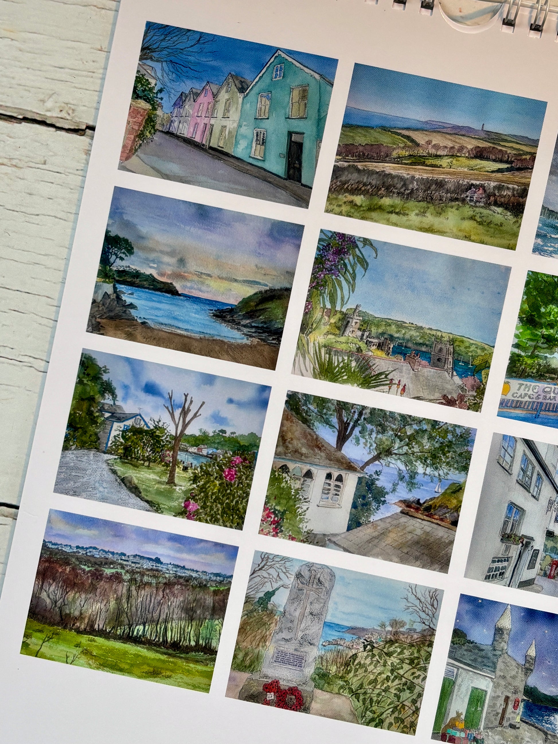 closeup shot of Cornwall calendar watercolor detail, colorful cottages coastal landscapes, Fowey art prints, 2026 wall calendar