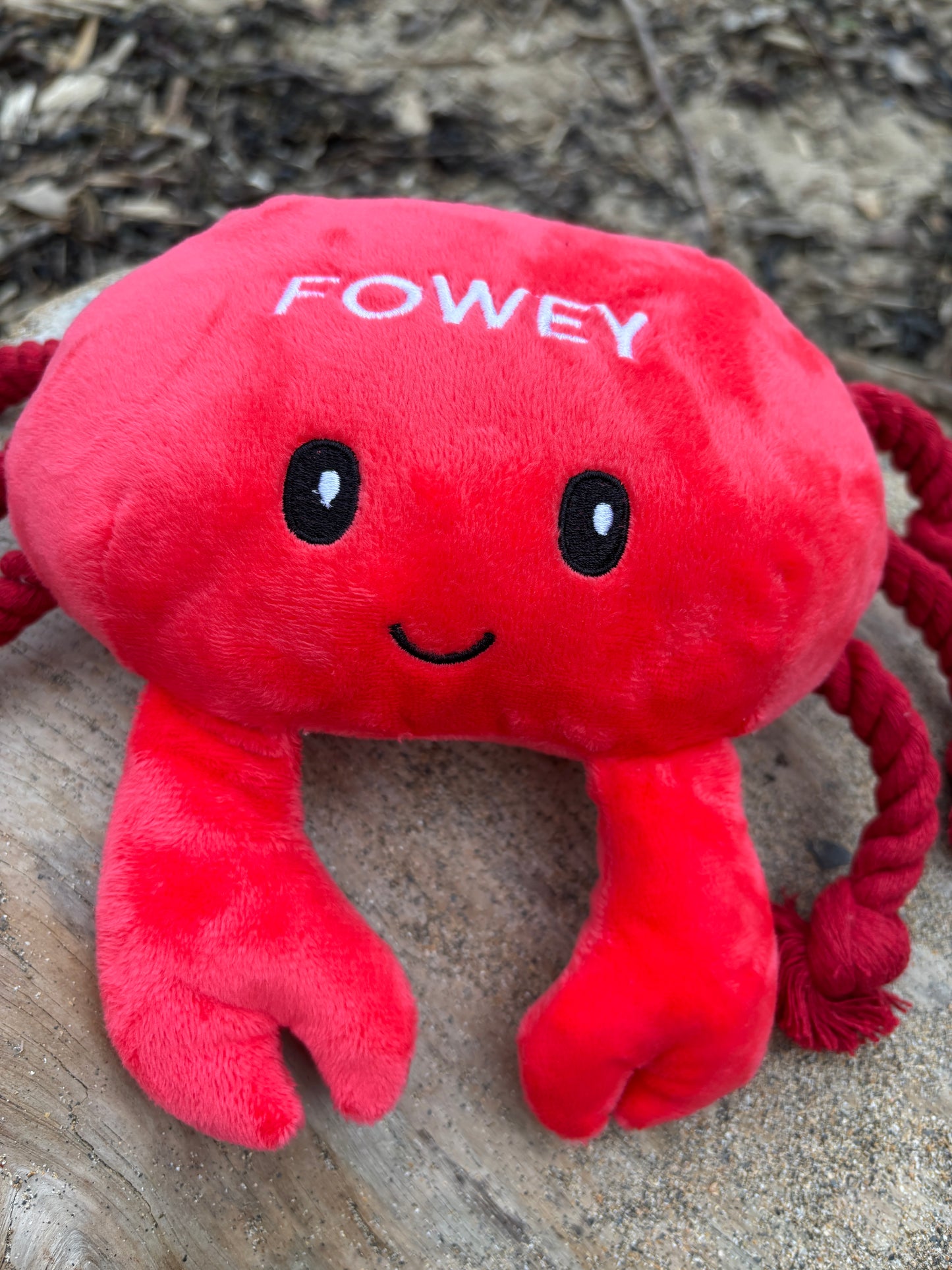 Fowey crab dog toy closeup red plush chew toy with embroidered "FOWEY" text and smile beach souvenir pet toy for small/medium dogs