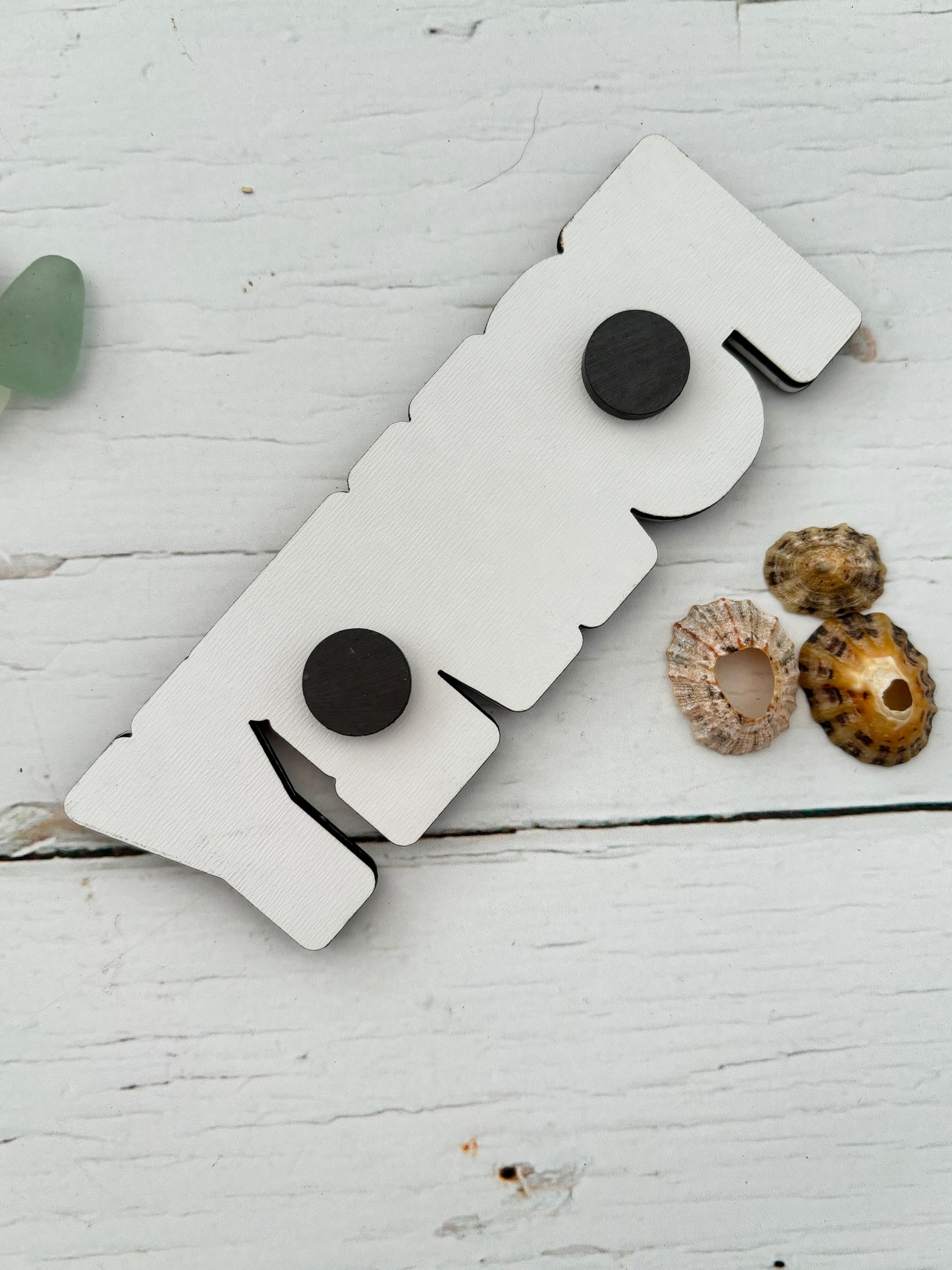 Fowey photo magnet back white, laser-cut wooden souvenir reverse side showing two black round magnets fridge decor attachment detail shot