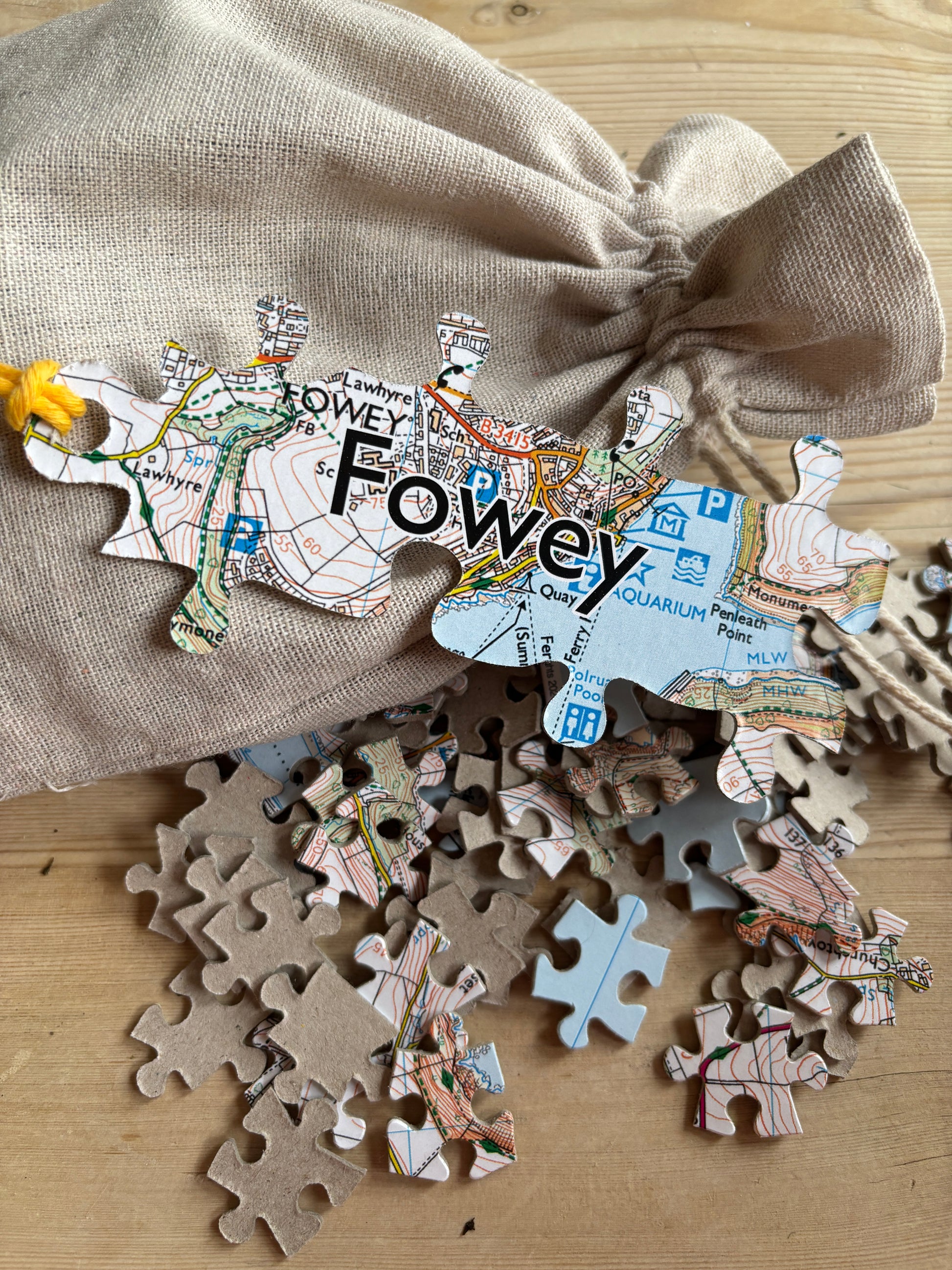 Fowey map jigsaw puzzle lizard-shaped puzzle pieces with a map print, presented in a calico bag Cornwall souvenir game for local map lovers