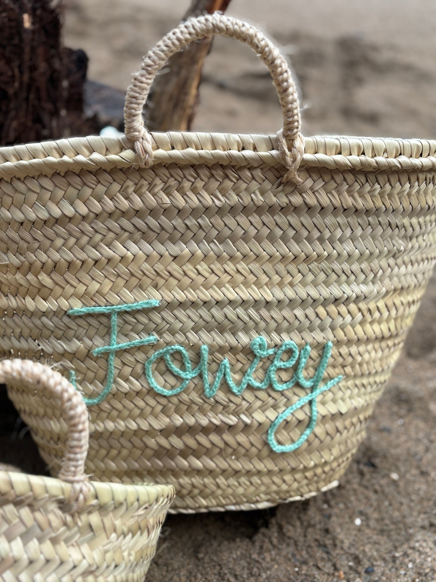 customized straw basket bag with Fowey seafoam green stitching hand-woven beach tote for a coastal holiday