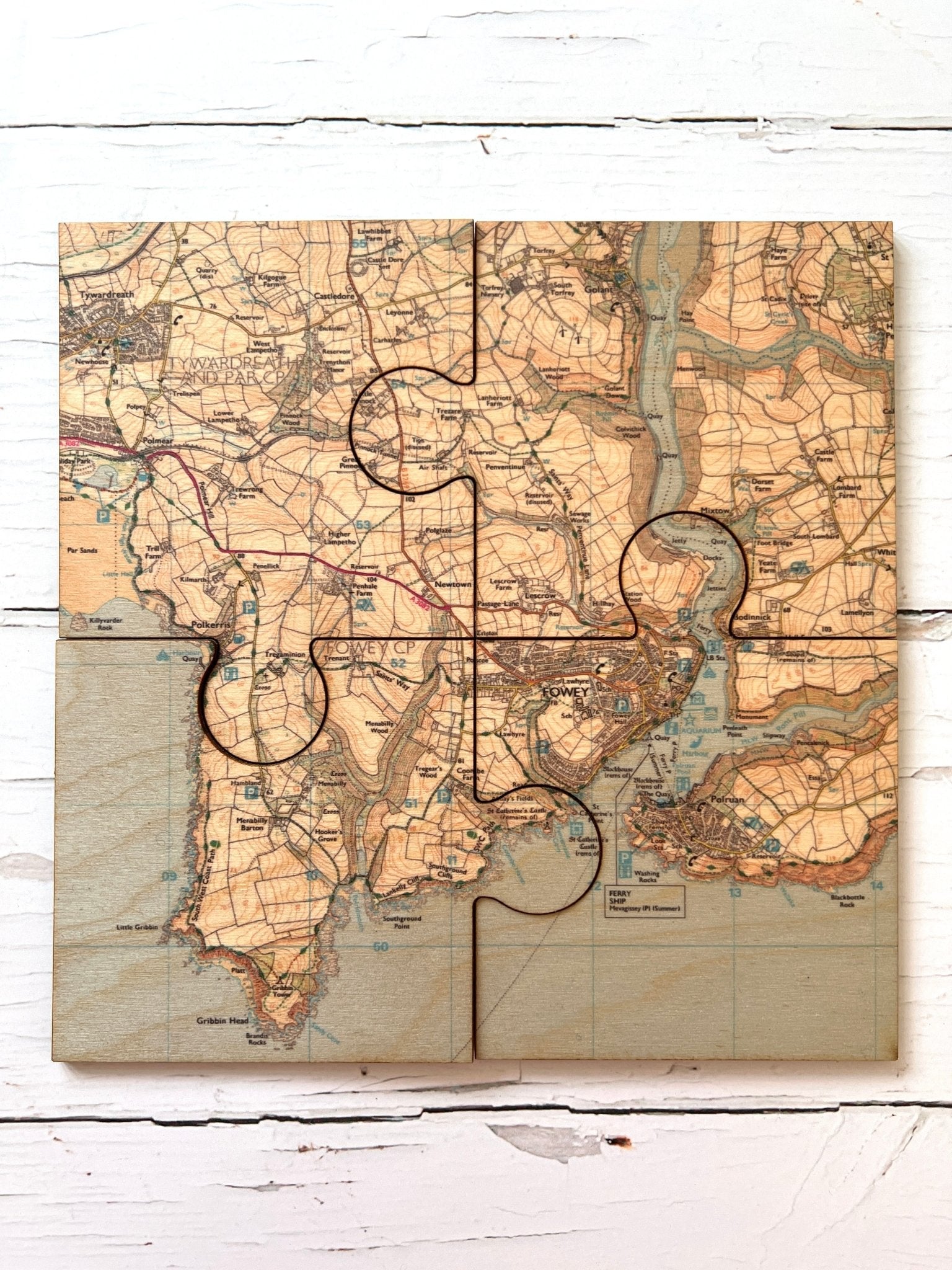 Fowey jigsaw map coasters four wooden map puzzle pieces fitted together to show the full Fowey and Polruan area map coastal home decor
