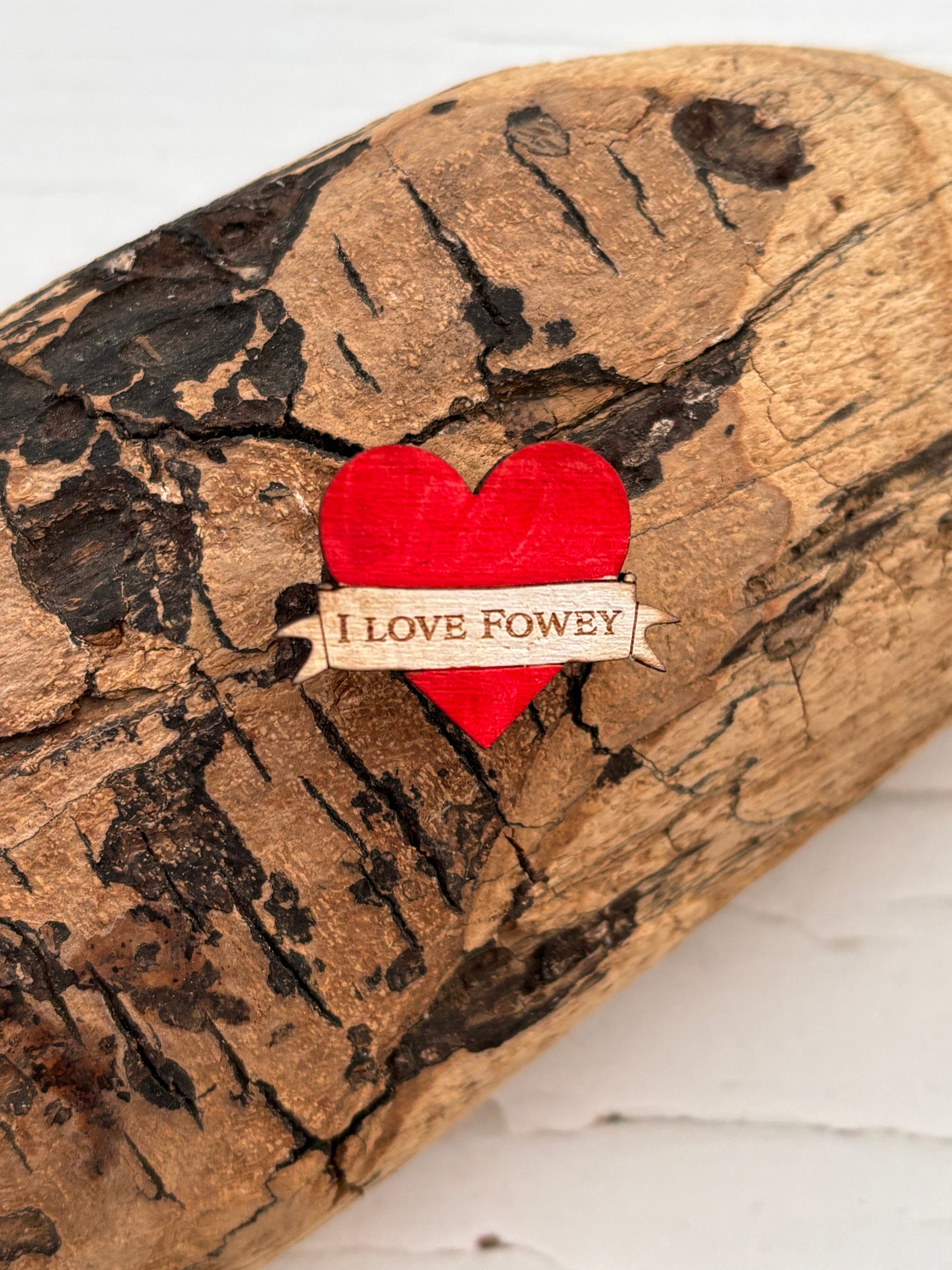 red heart-shaped wooden pin badge with “LOVE FOWEY” engraving—handcrafted coastal gift, eco-friendly and sentimental