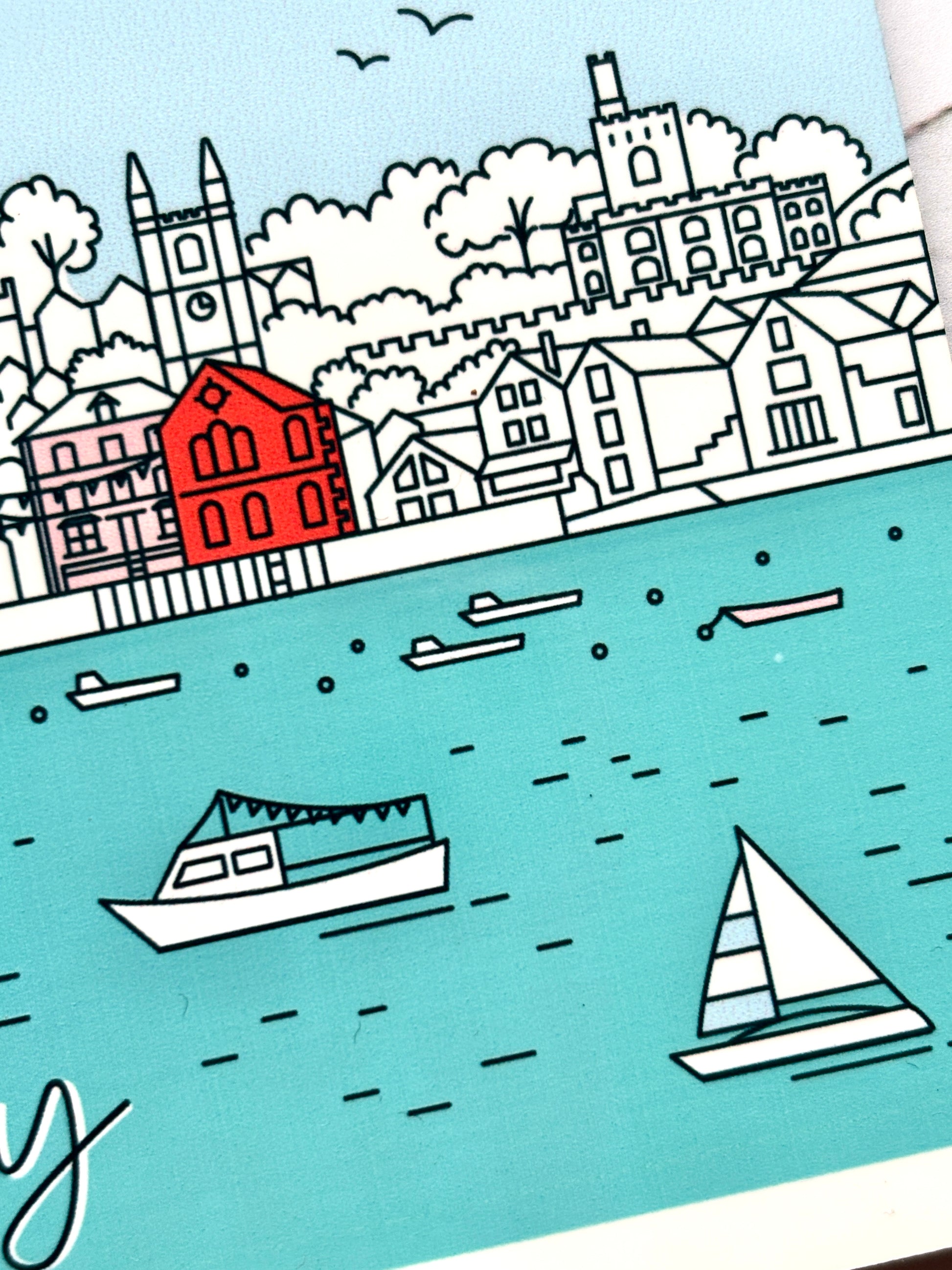 closeup shot of Fowey skyline coaster with sailboats, castle, church spires, and pastel coastal town—stylish nautical home decor