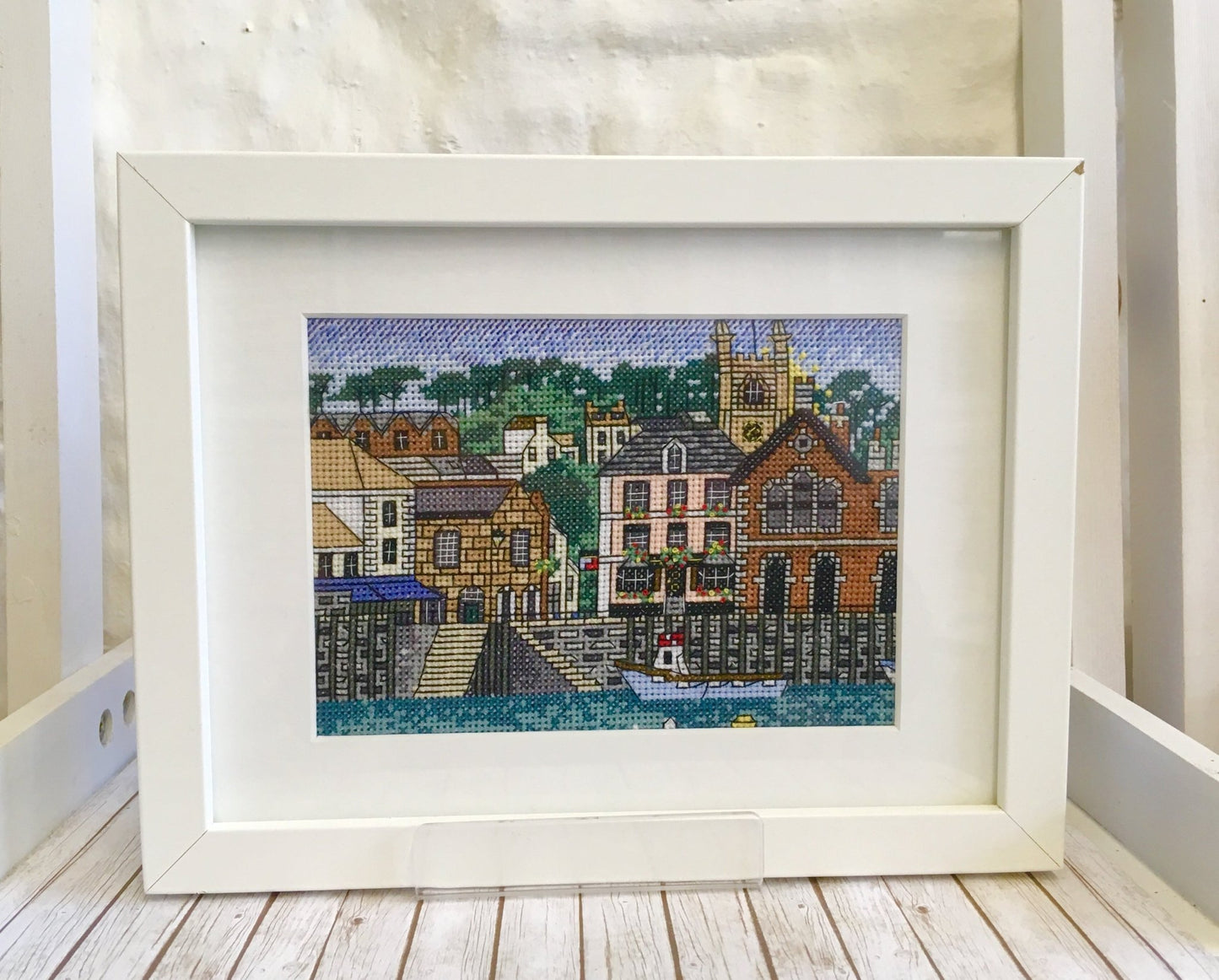 framed Fowey harbour cross stitch, completed Cornwall embroidery, white frame coastal town art, handmade needlework