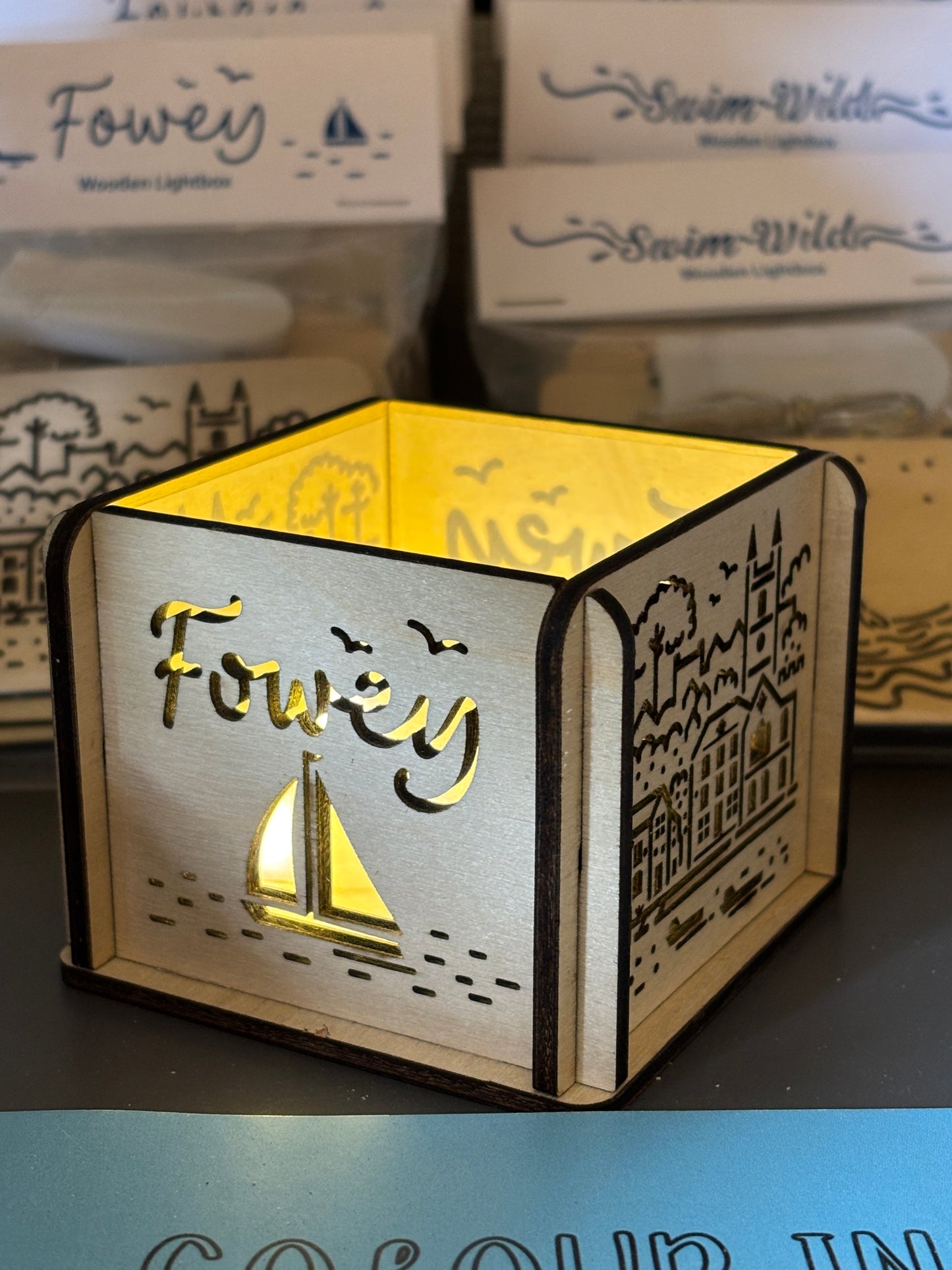 Fowey lightbox side view, wooden sailboat cut-out design, Cornwall LED light decoration, engraved coastal table lamp