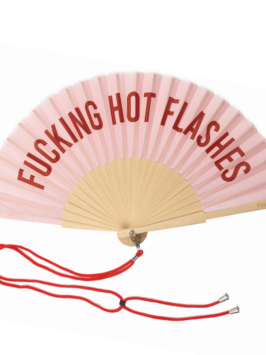 Pink hand fan with 'F***ING HOT FLASHES' text on a white background