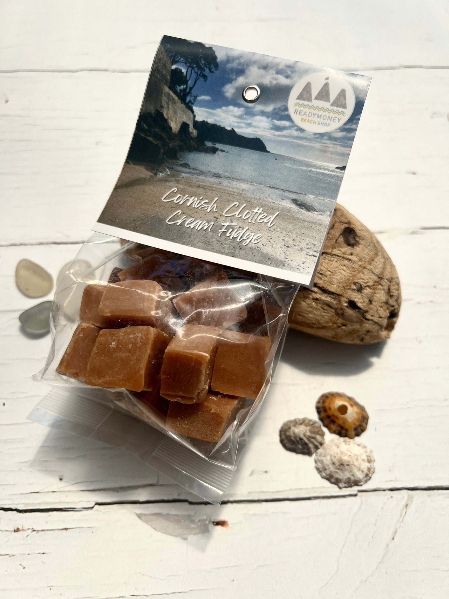 bag of rich Cornish Clotted Cream Fudge cubes seafront beach shop souvenir sweet treat. Coastal food gift, Fowey, Cornwall
