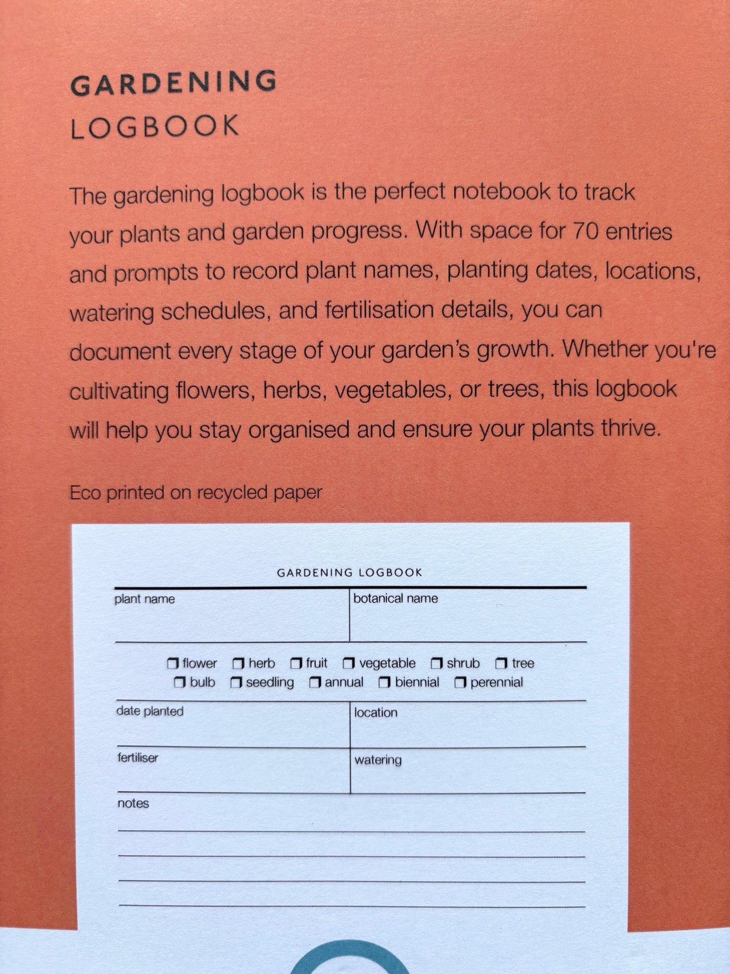he back of a gardening logbook, showing an eco printed page for tracking plants, dates, and watering schedules garden planning tool
