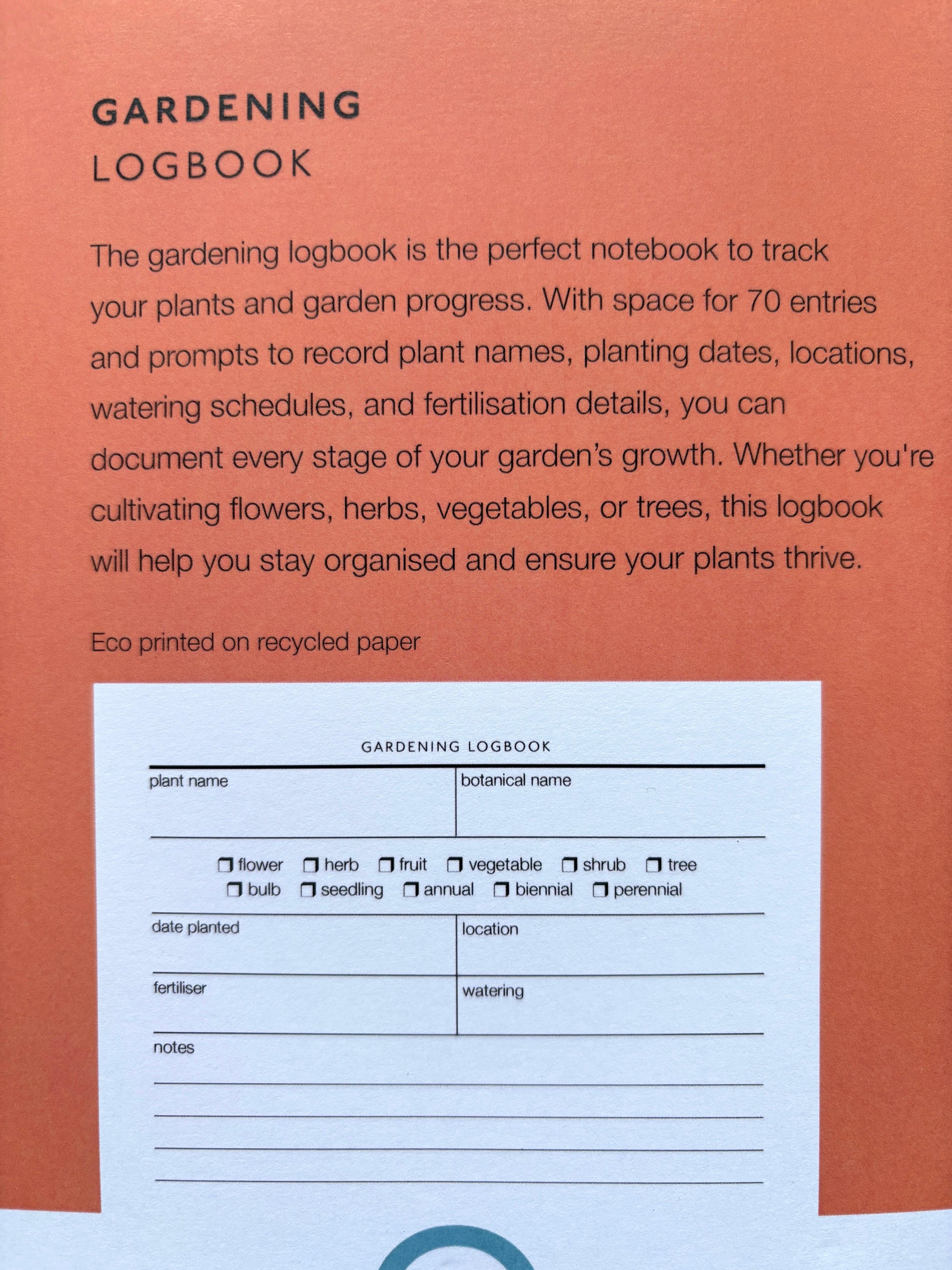 he back of a gardening logbook, showing an eco printed page for tracking plants, dates, and watering schedules garden planning tool