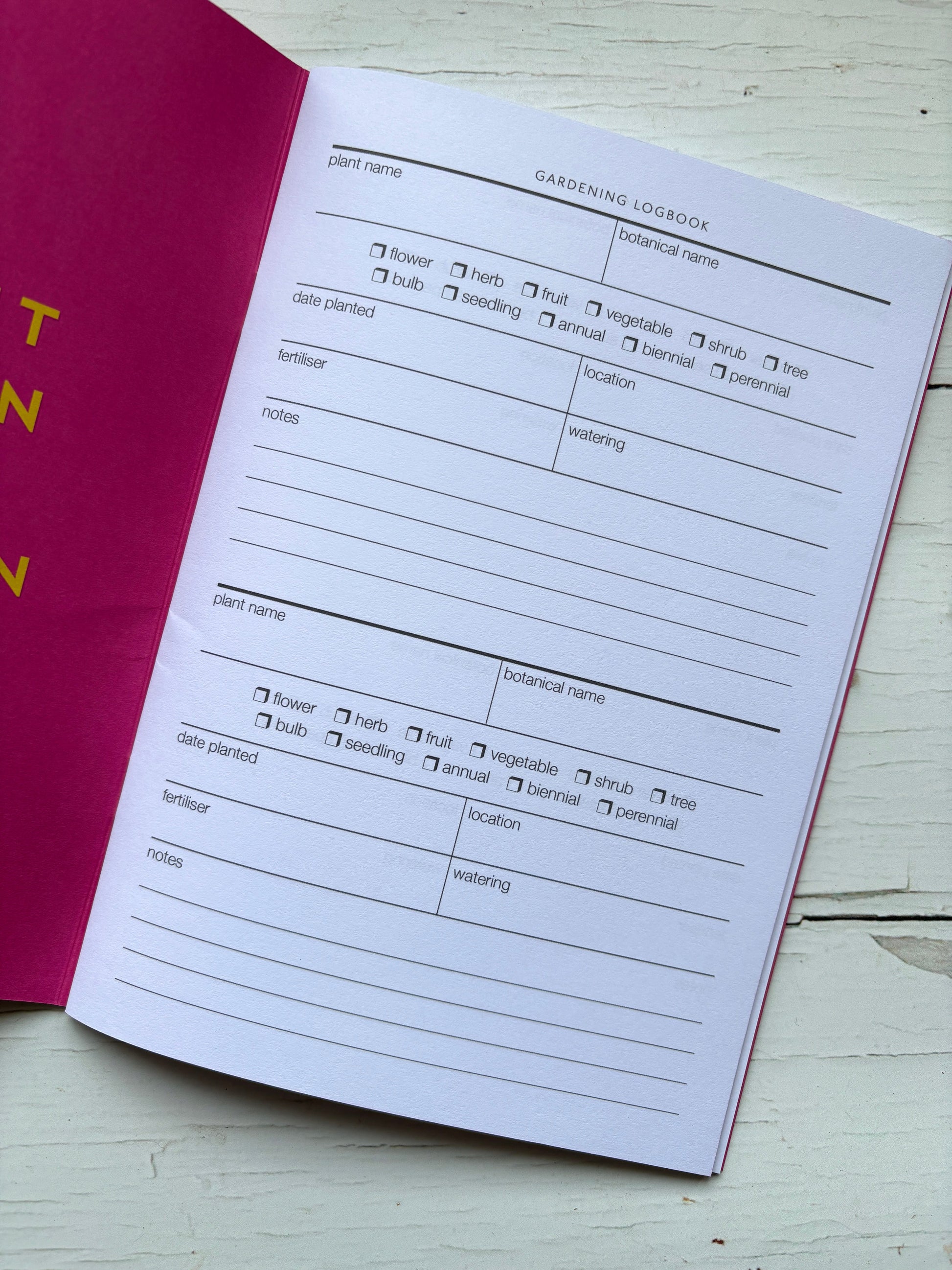 open gardening logbook journal showing plant tracking pages use this garden planner to record planting dates, fertilizer, and watering