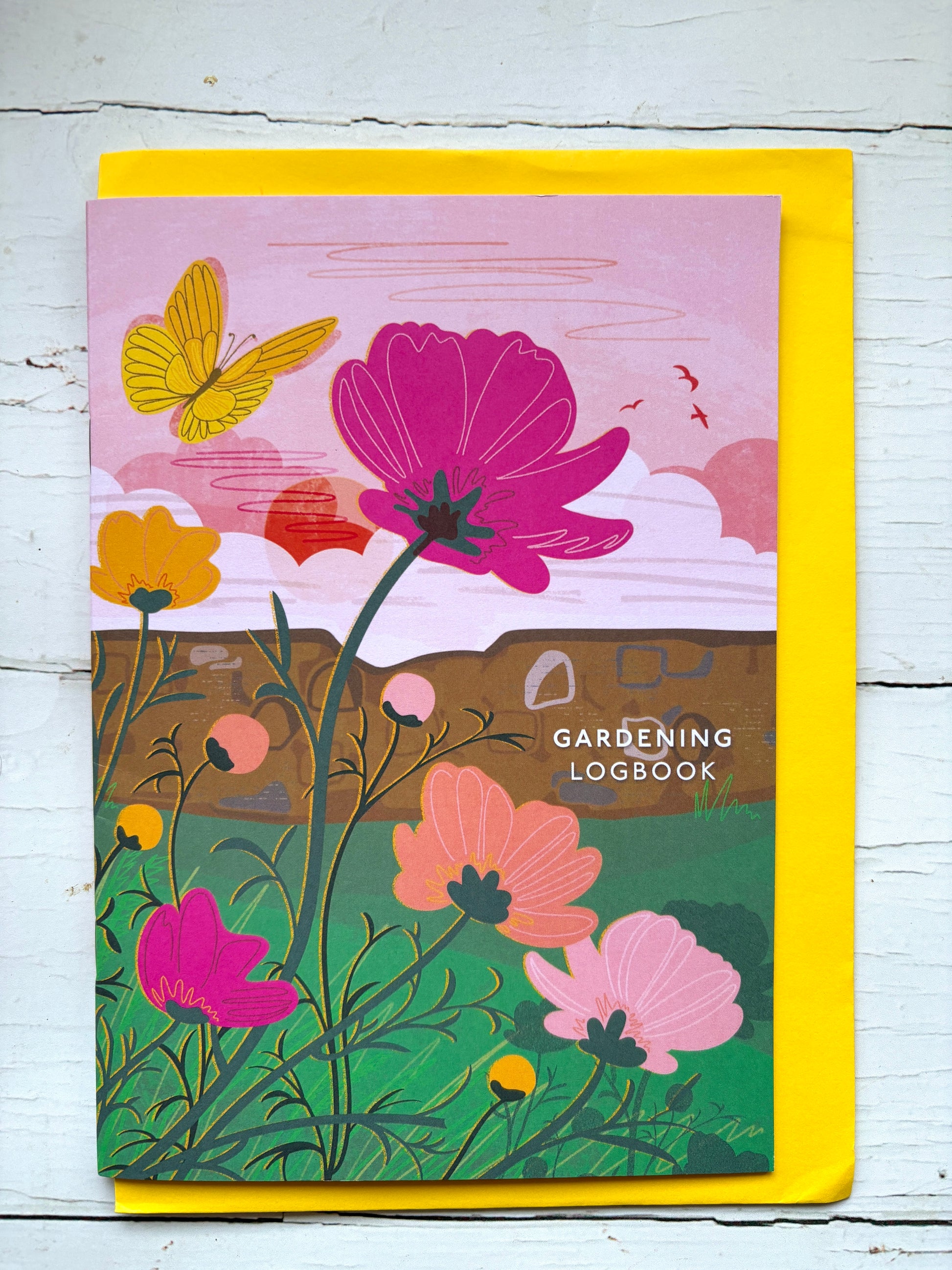 colorful gardening logbook journal featuring botanical art with flowers and a butterfly perfect for garden planning and tracking