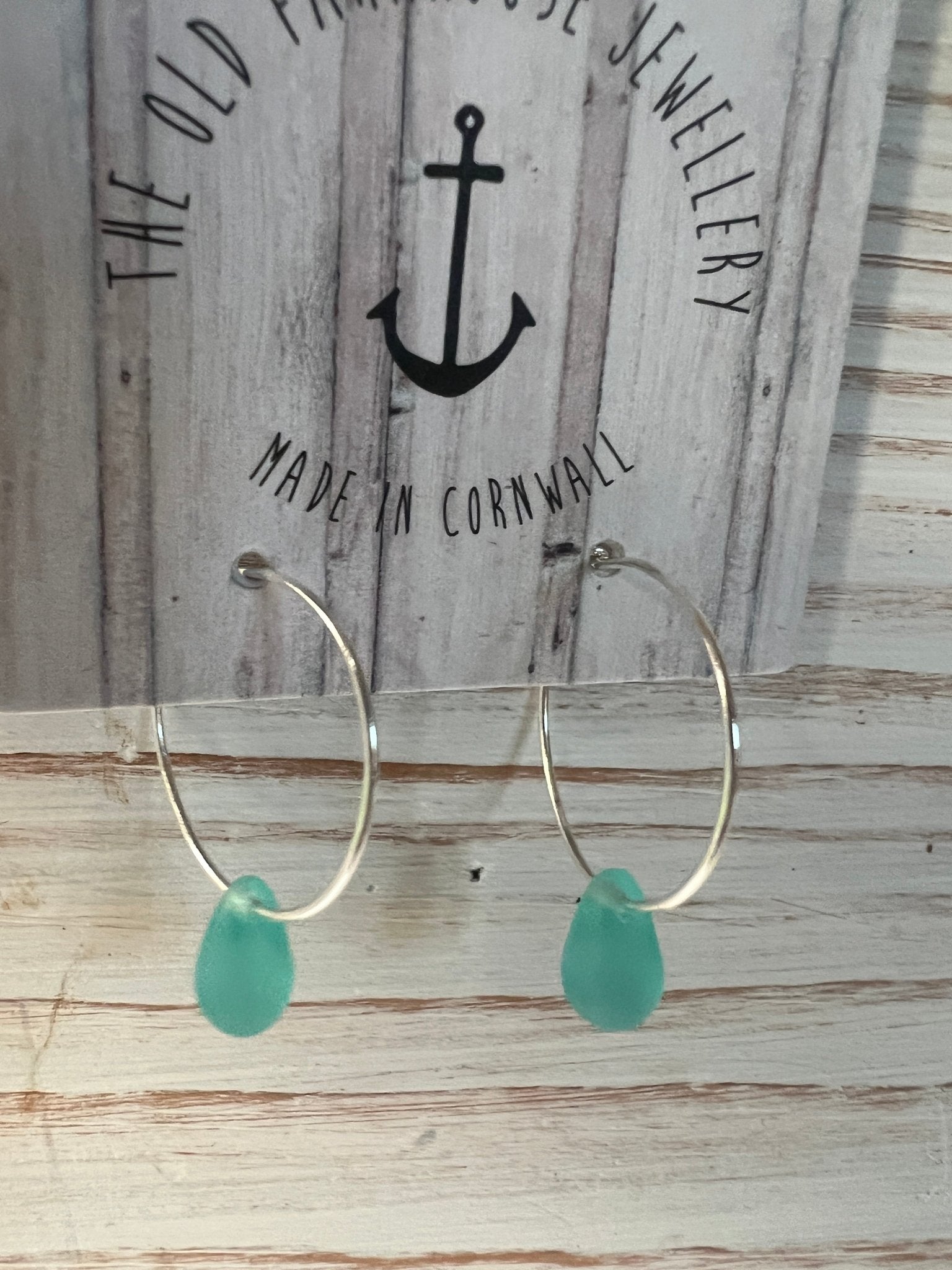 aqua sea glass style glass teardrop bead hoop earrings handmade jewellery made in Cornwall with a coastal and nautical look