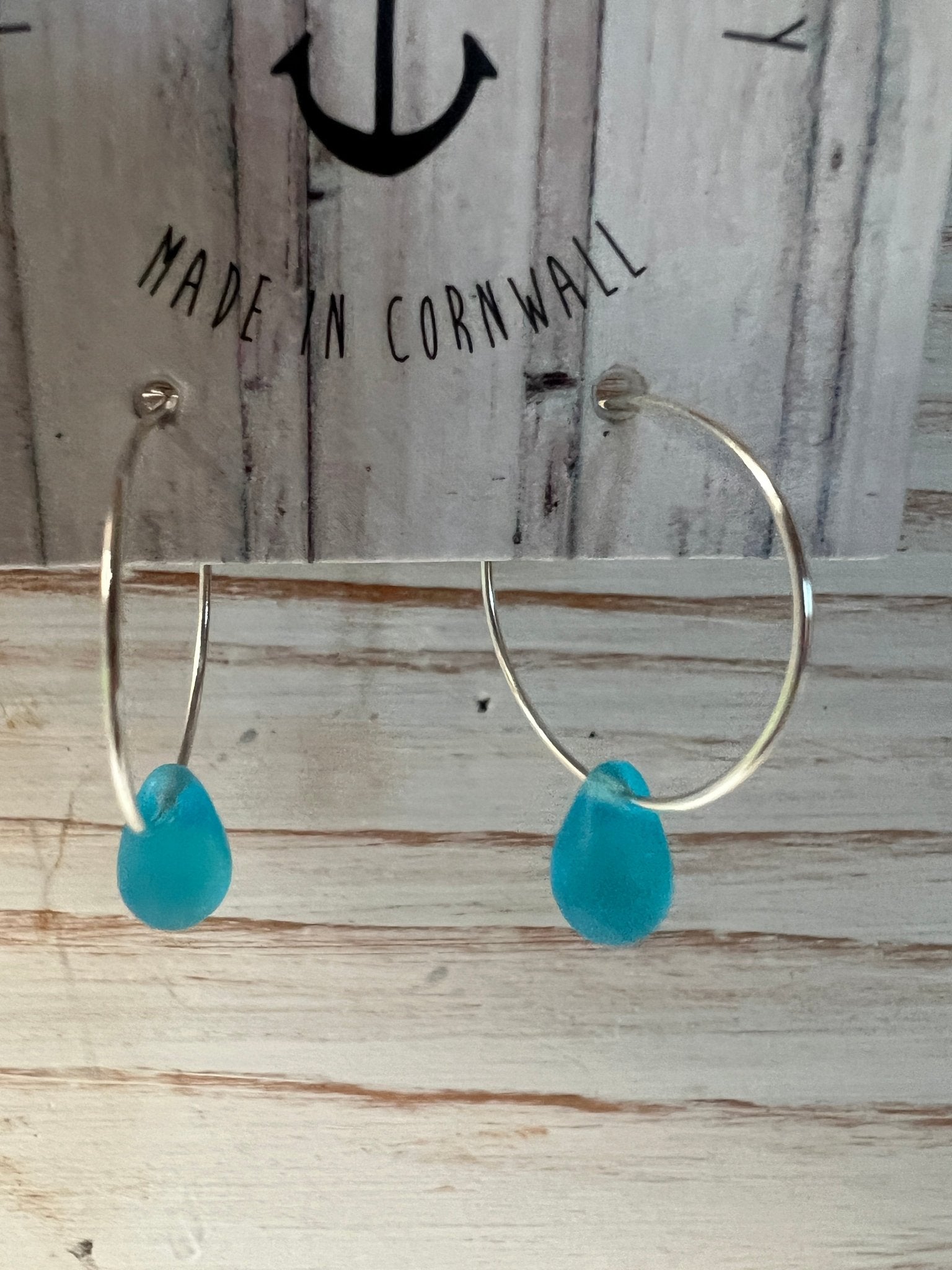 bright blue sea glass style glass teardrop bead hoop earrings handmade jewellery made in Cornwall with a coastal aesthetic