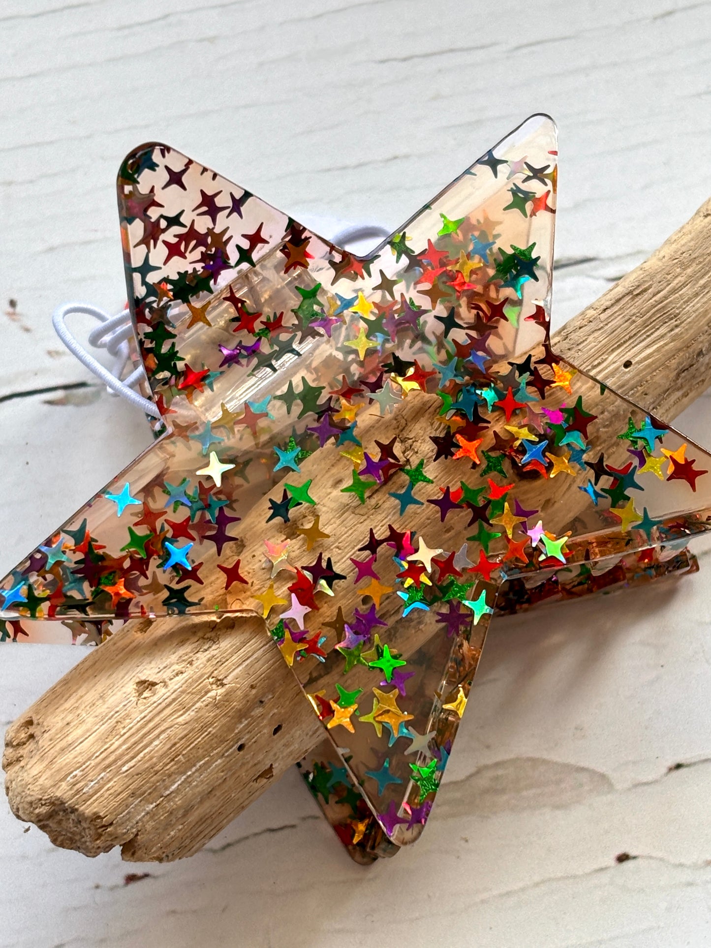 glitter star hair claw—transparent clip with confetti sparkle, secure grip, and playful celestial-inspired styling