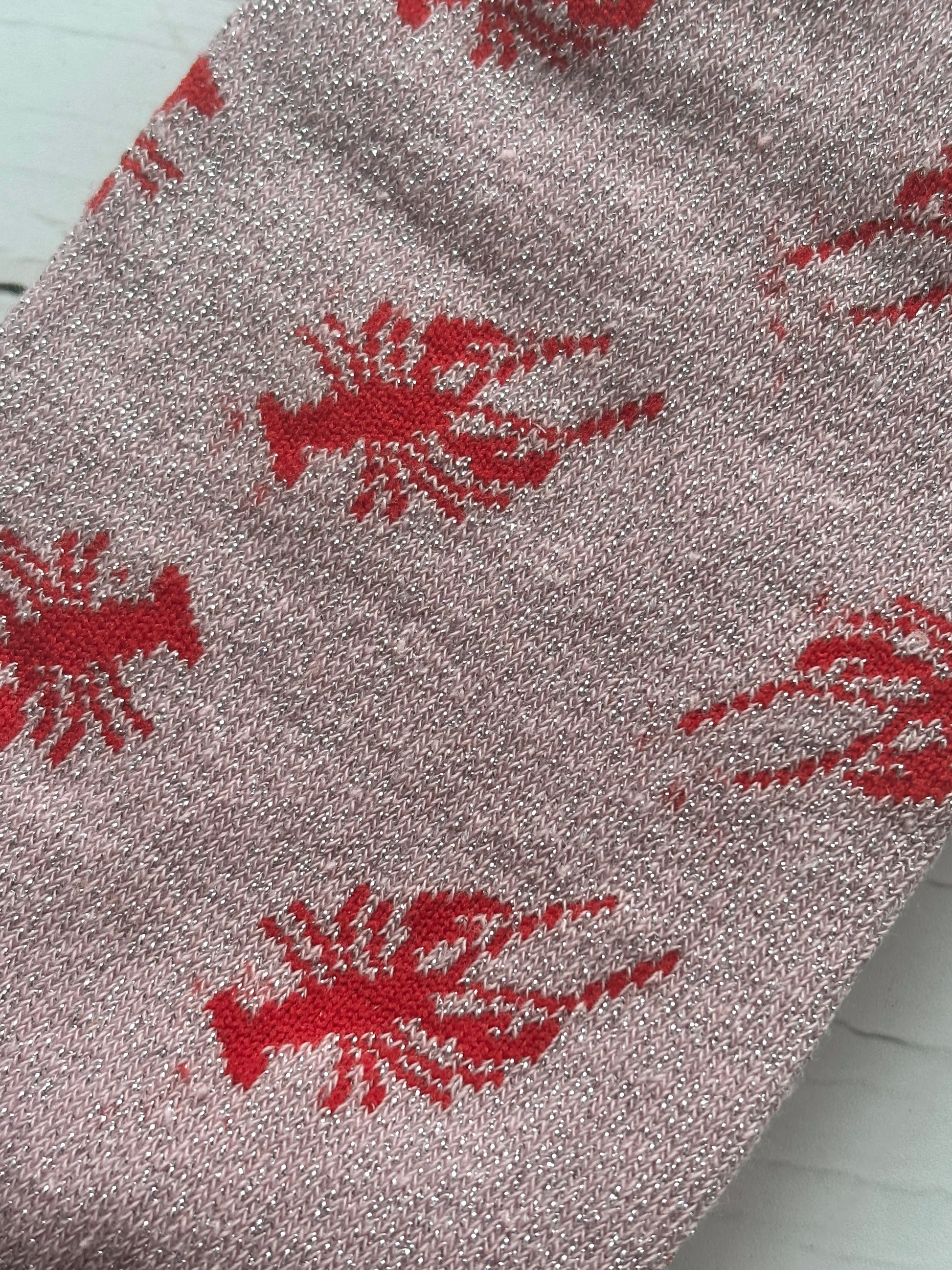 closeup shot of knit pattern of pink glitter socks with bold red lobster print unique coastal gift and novelty sea animal apparel