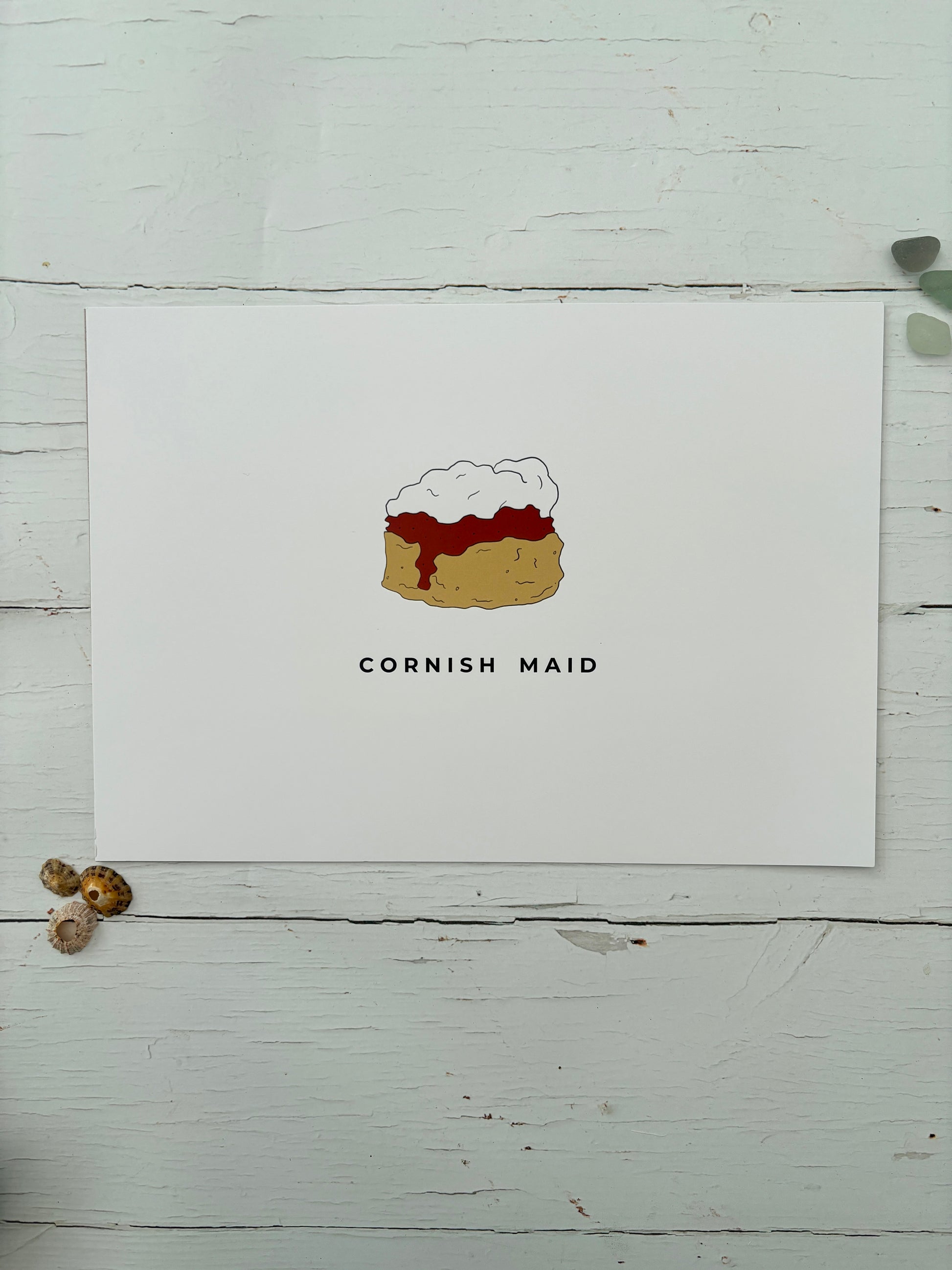 an a4 art print titled 'Cornish Maid' featuring a minimalist illustration of a scone with jam and clotted cream foodie gift, Cornwall art