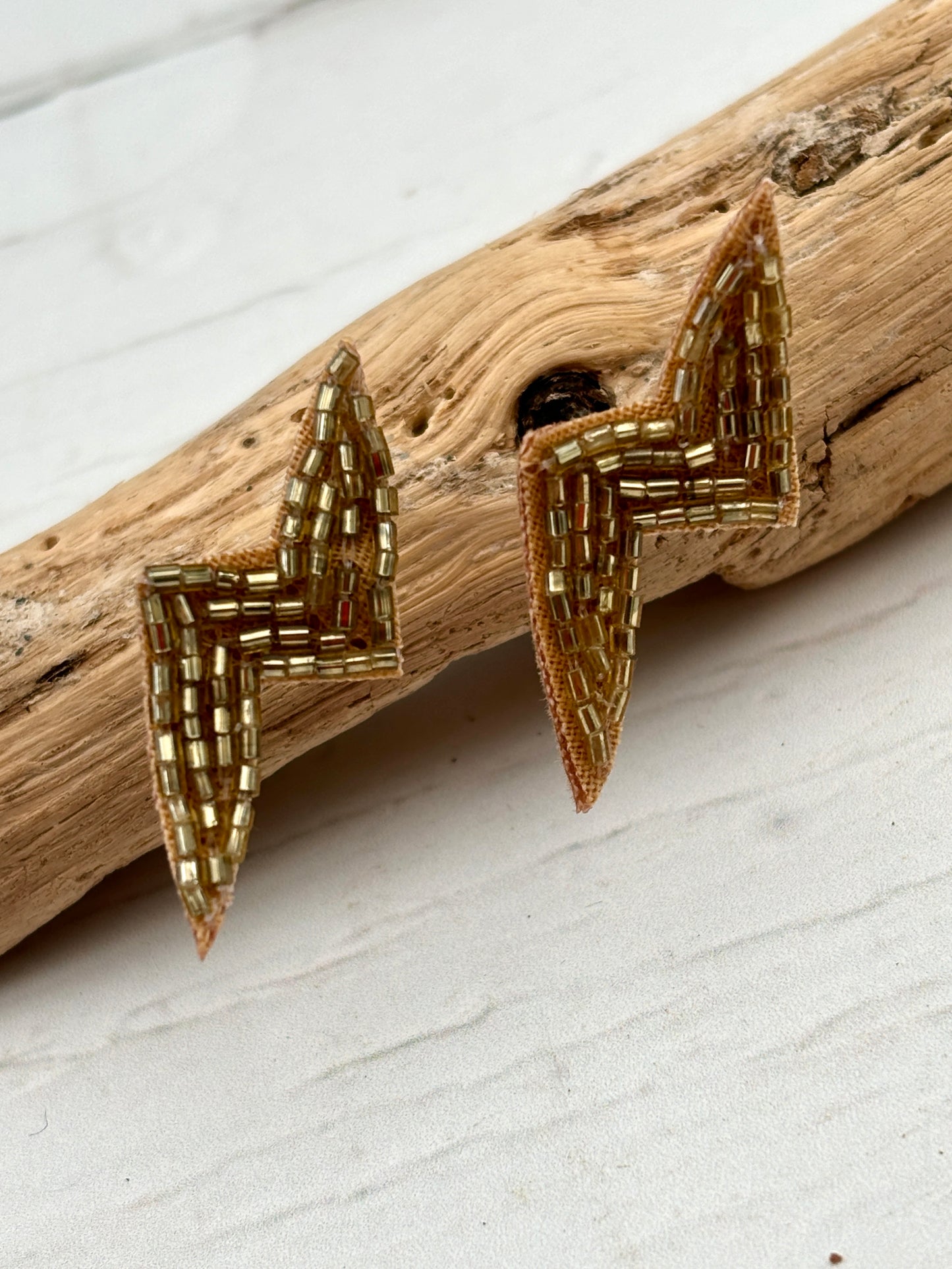 gold beaded lightning bolt earrings hand embroidered jewellery with a statement, glam, and rock-chic aesthetic unique gift idea