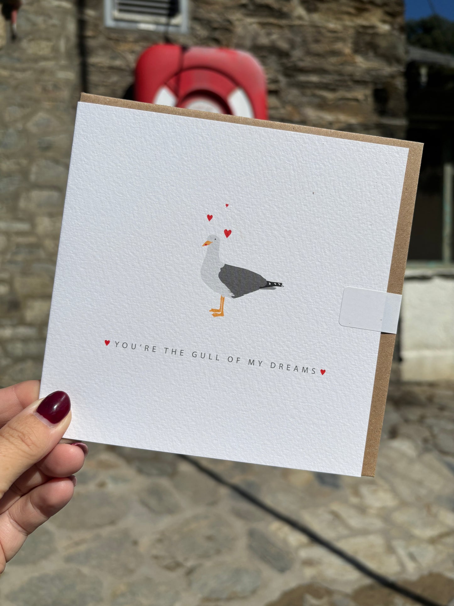funny square card with seagull art and tiny hearts coastal pun: "Gull Of My Dreams." romantic and unique beach stationery