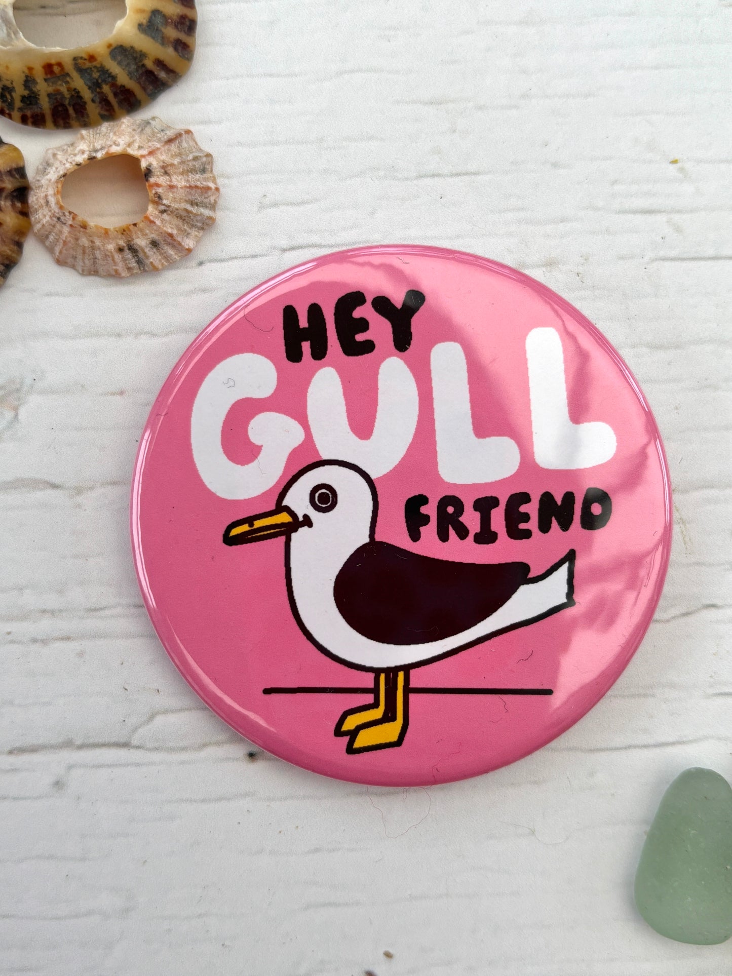 pink seagull badge with the text 'Hey Gull Friend' a funny novelty pin and nautical accessory great coastal gift for friends