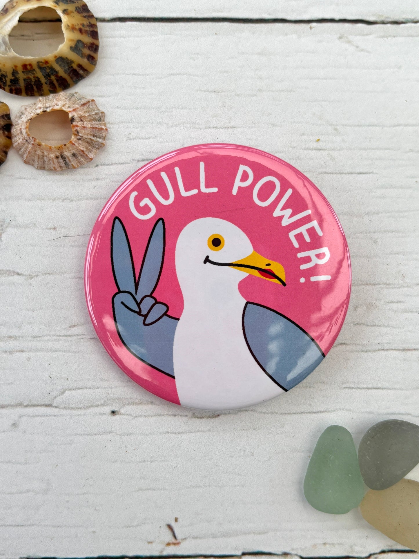 pink seagull badge with the slogan 'Gull Power!' a funny feminist pin and nautical accessory great coastal novelty gift