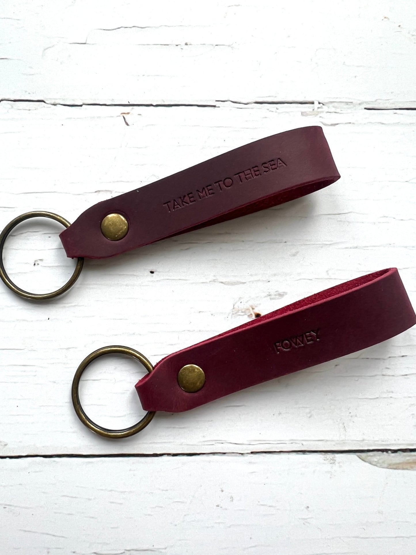 handmade dark brown leather keyring—coastal Fowey design with brass hardware and “Take Me to the Sea” stamp