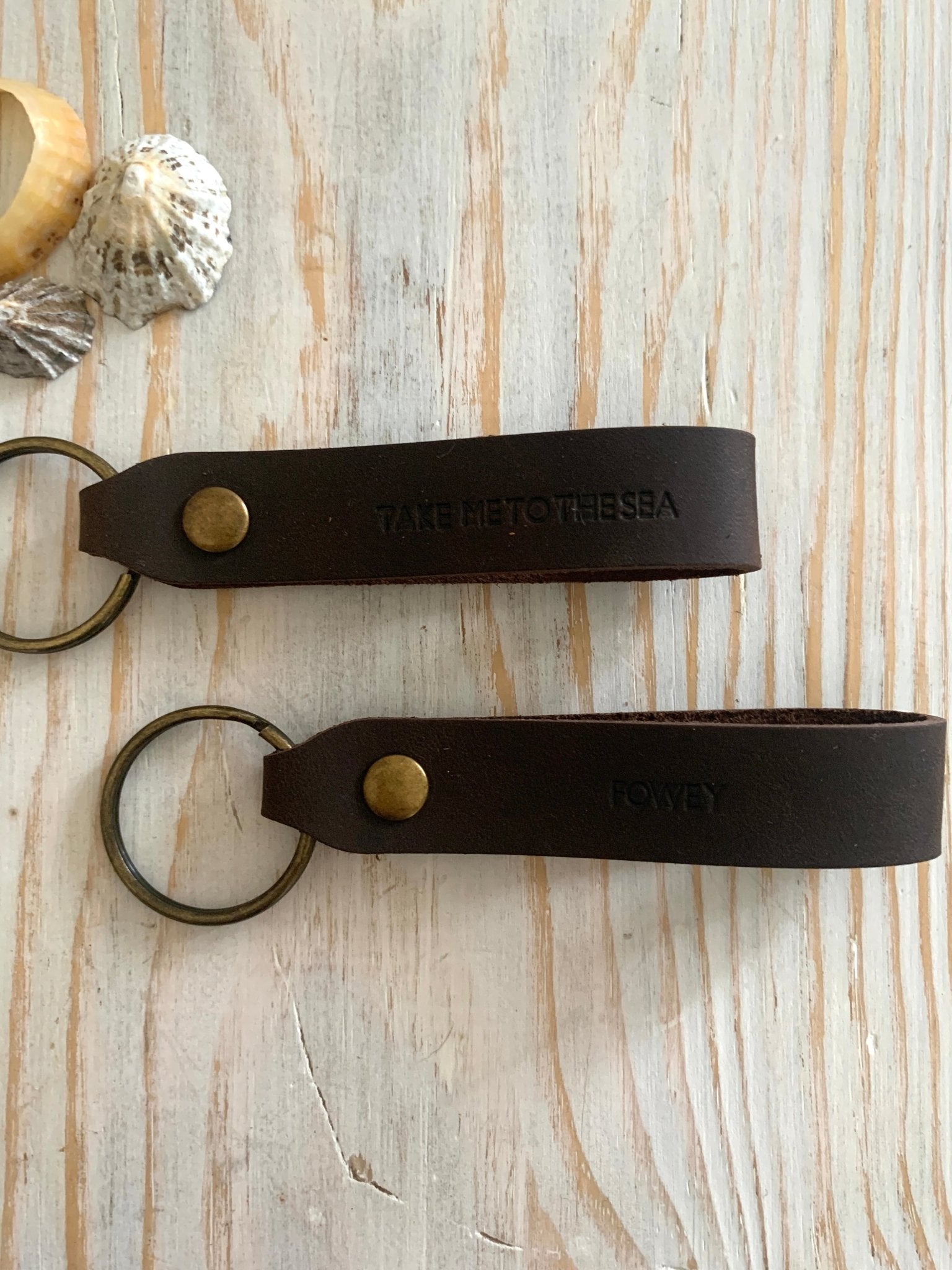 handmade dark brown leather keyring—nautical “Take Me to the Sea” stamp with brass ring and rustic coastal charm