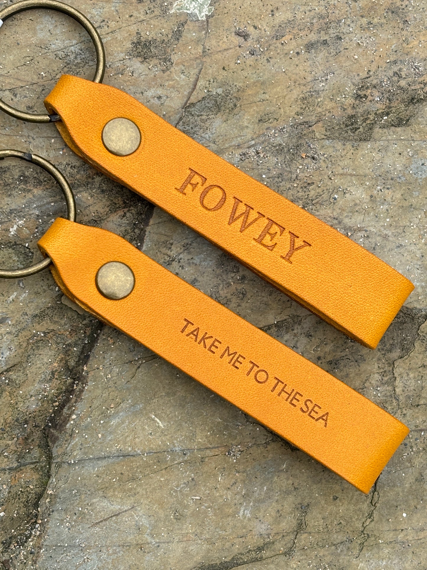 mustard leather keyring—handmade coastal accessory with brass ring, Fowey and sea-inspired stamped design