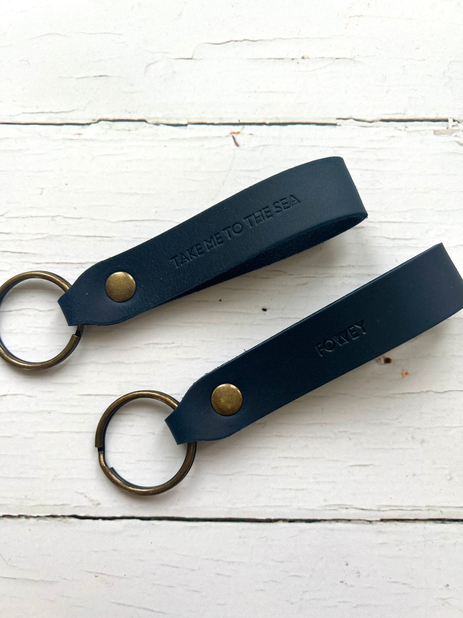 handmade navy leather keyring—coastal stamped design with brass hardware, “Fowey” and “Take Me to the Sea” text
