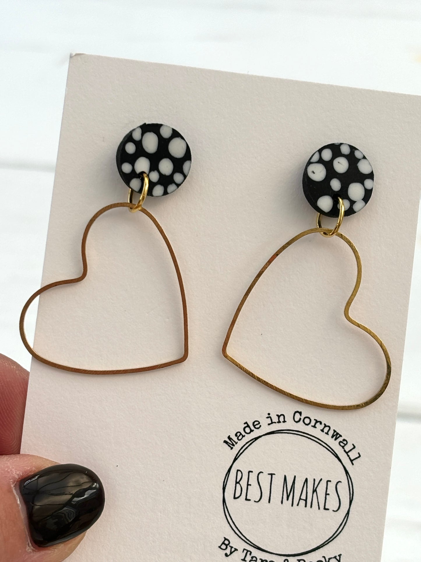 handmade dot heart earrings—black polka dot studs with gold open heart dangles, playful artisan gift