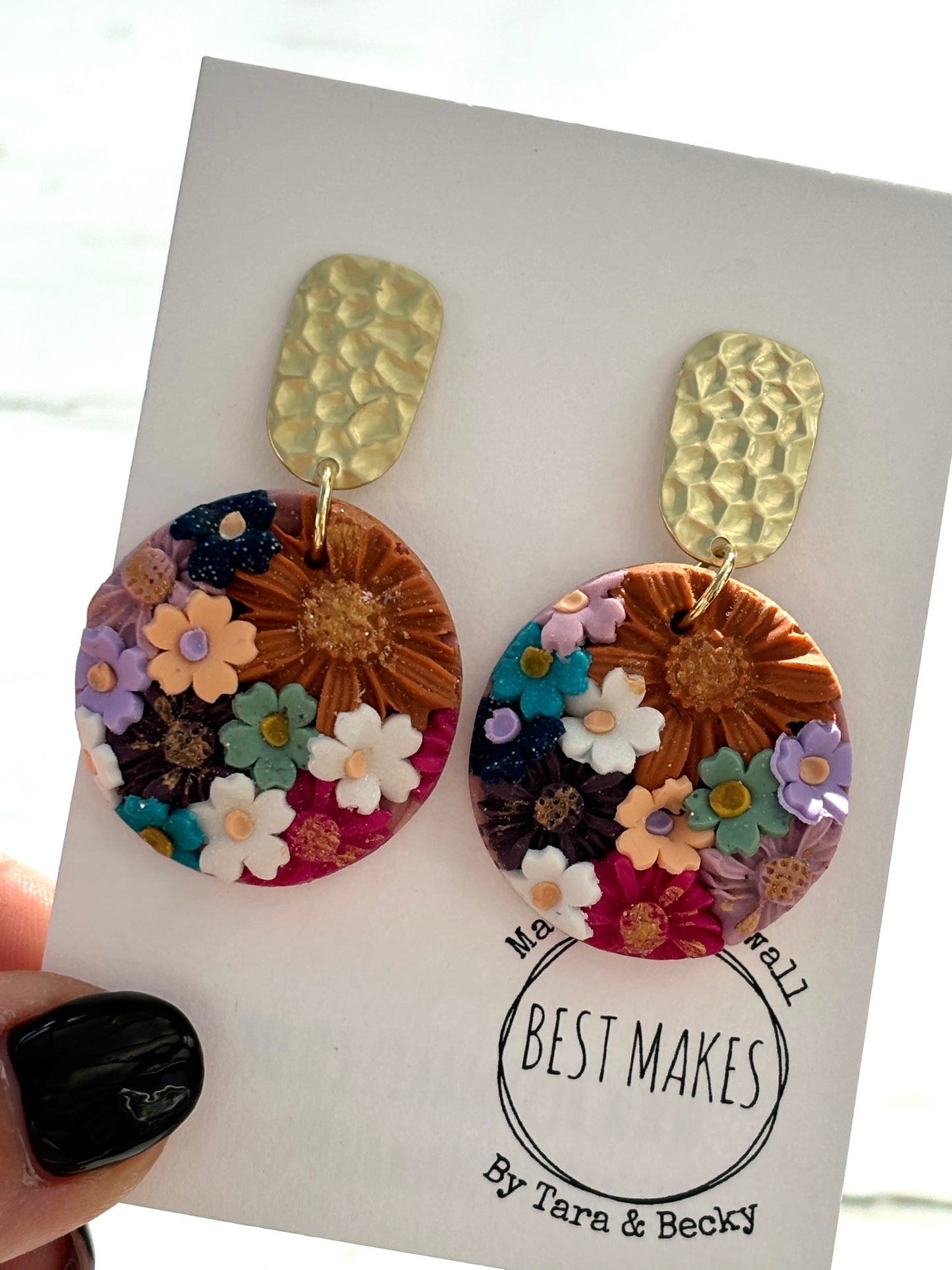 handmade floral brass earrings—hammered gold studs with vibrant textured blooms, artisan spring gift