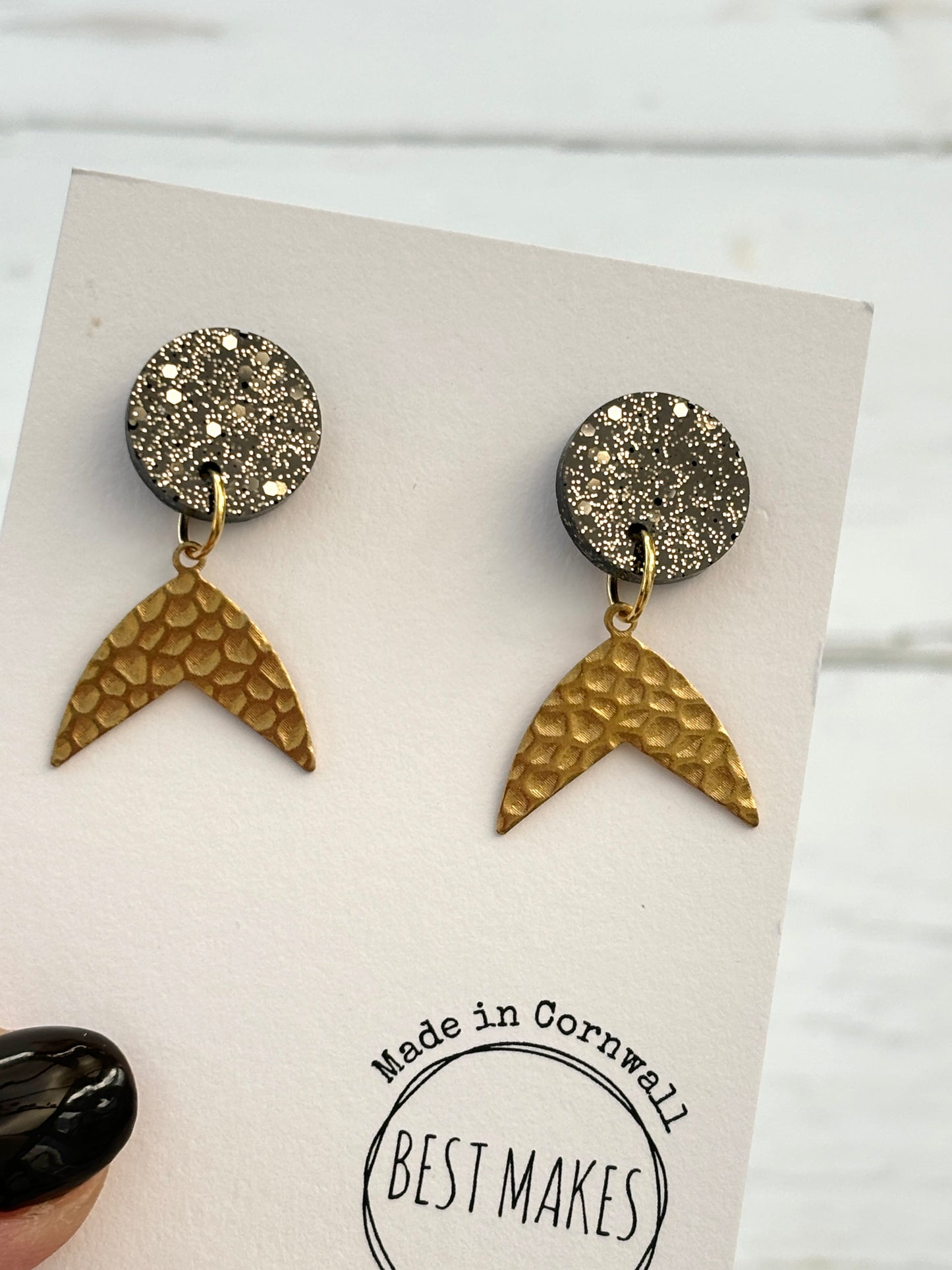 handmade mermaid tail earrings—black glitter studs with gold textured dangles, ocean-inspired artisan gift