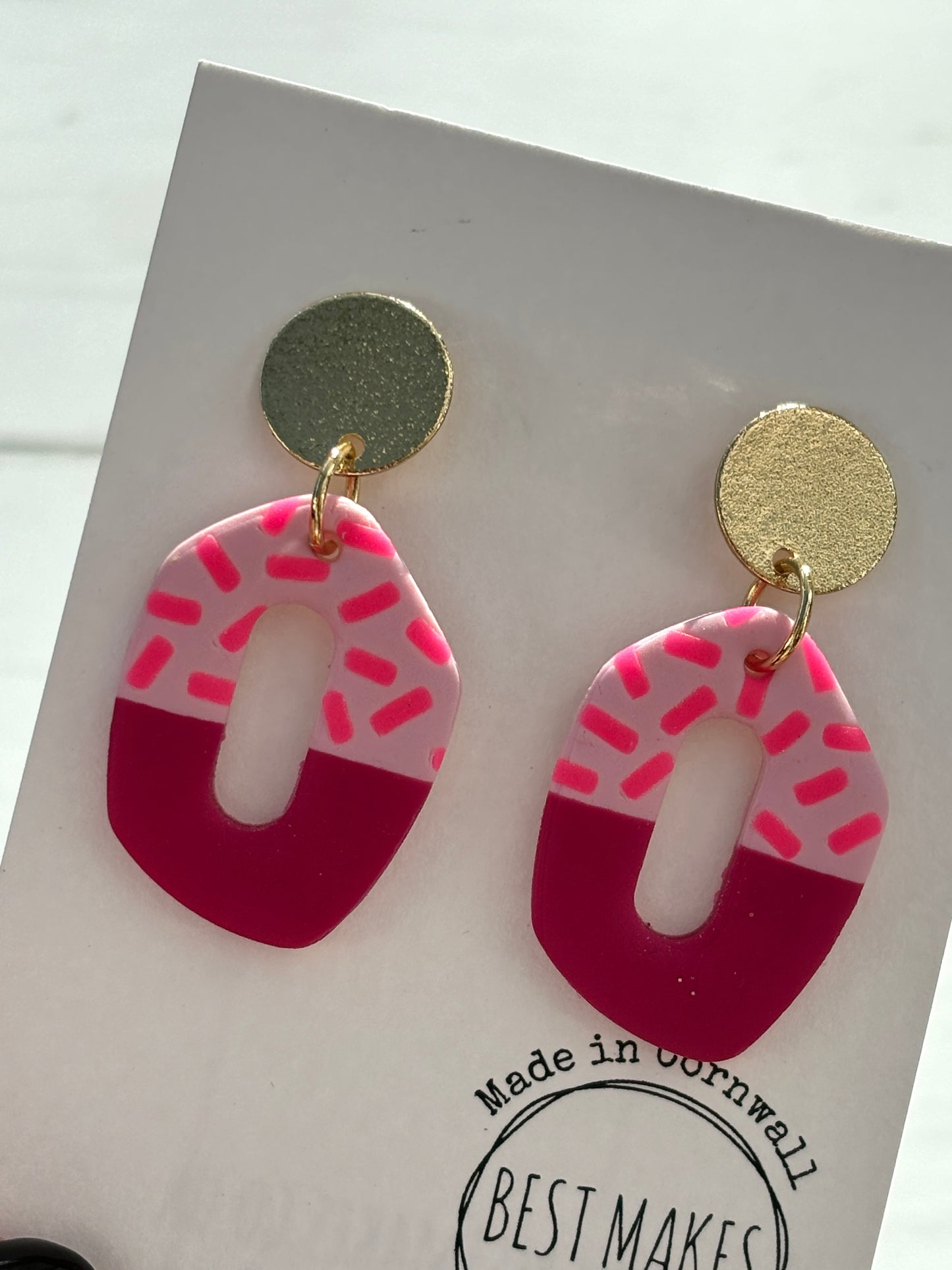 handmade pink asymmetric earrings—gold stud with cutout dangle, sprinkle pattern, bold modern gift
