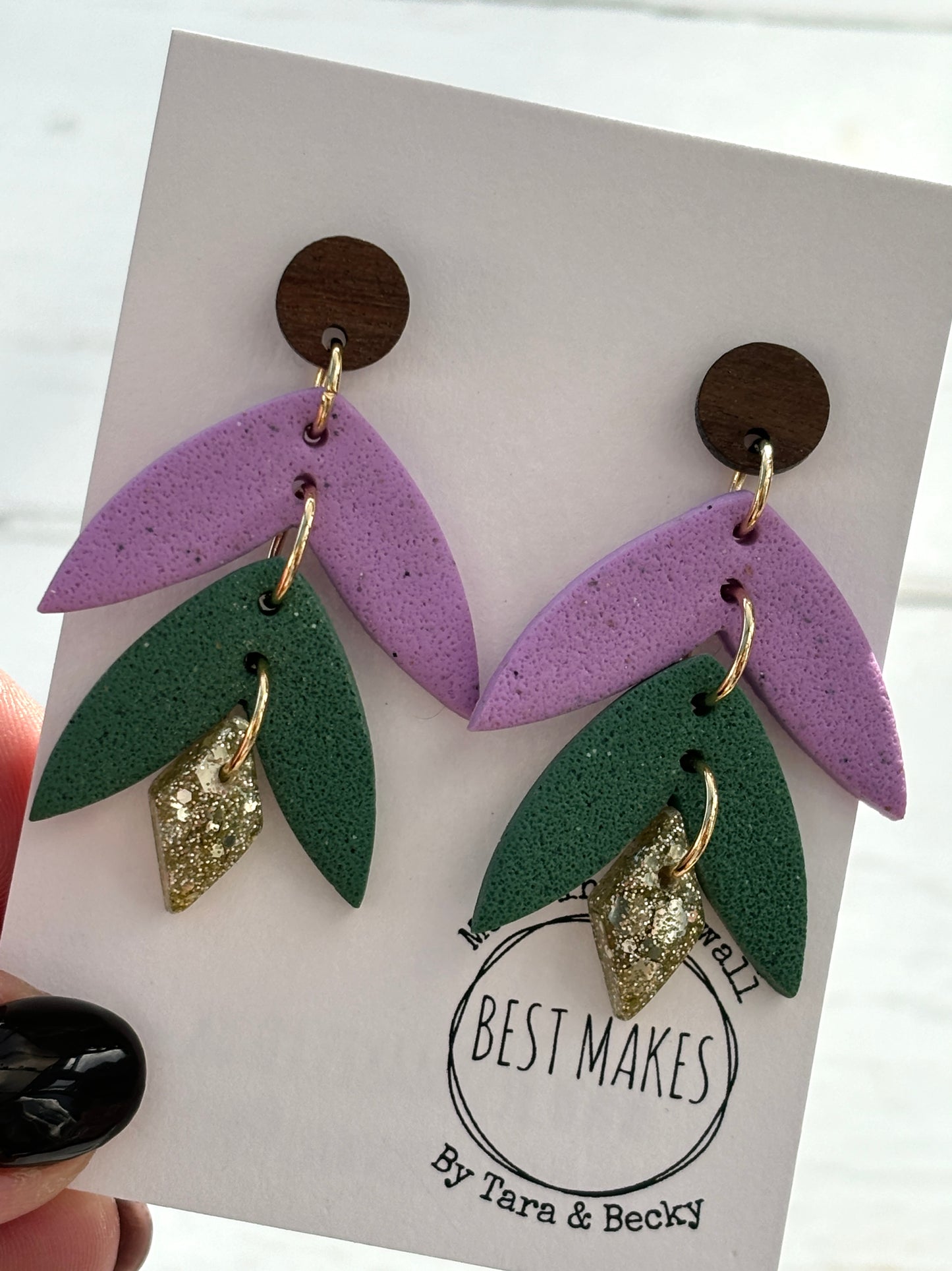 handmade leaf earrings—purple, green, and gold glitter layers with wood studs, bold botanical gift