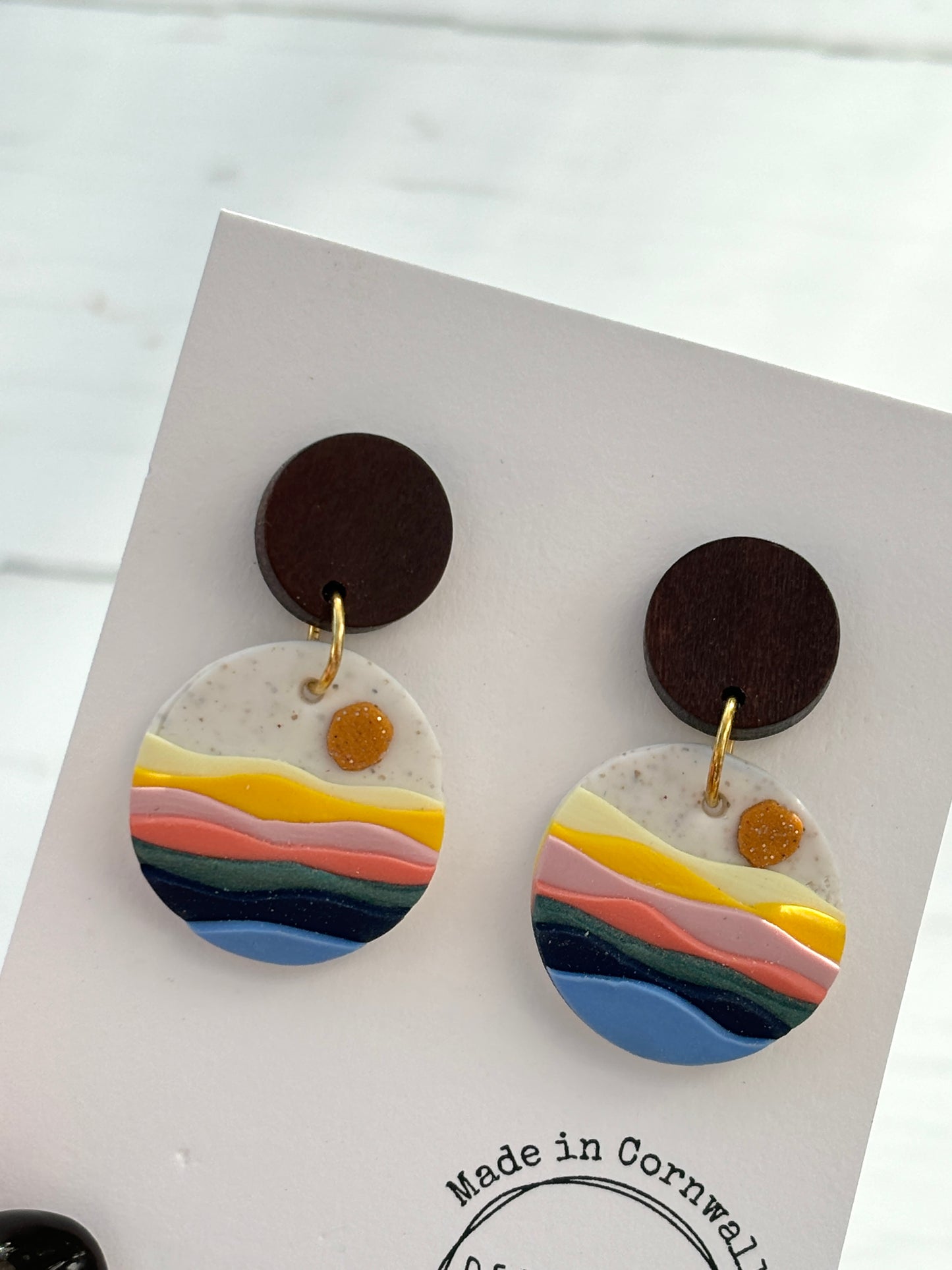 handmade seaside sunset earrings—layered coastal colors with glitter sun, bold statement studs, made in Cornwall