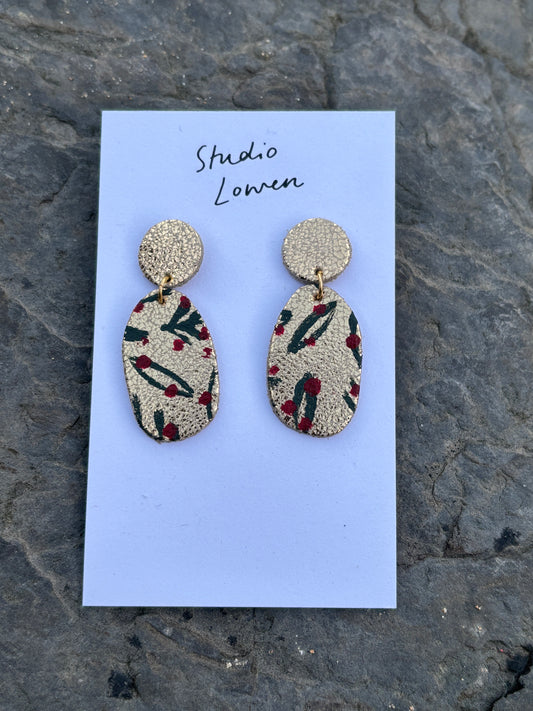hand-painted Christmas earrings—glittery gold drops with bold red accents, artisan-made for holiday statement style