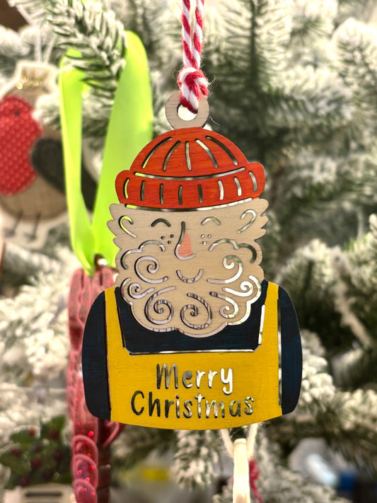 laser cut wooden Santa ornament with hand-painted details, red knit hat, curly beard, festive holiday decoration