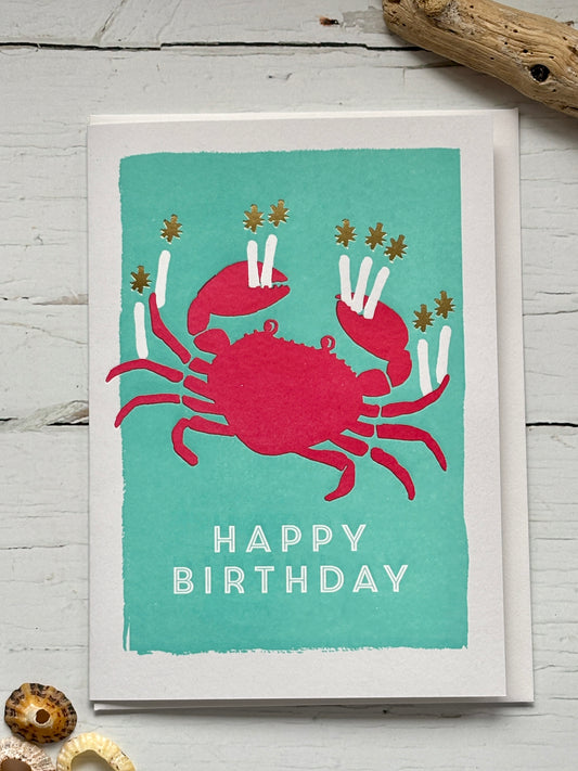 crab birthday card—red crab with candle claws on teal, playful coastal design for ocean lovers and festive summer gifting