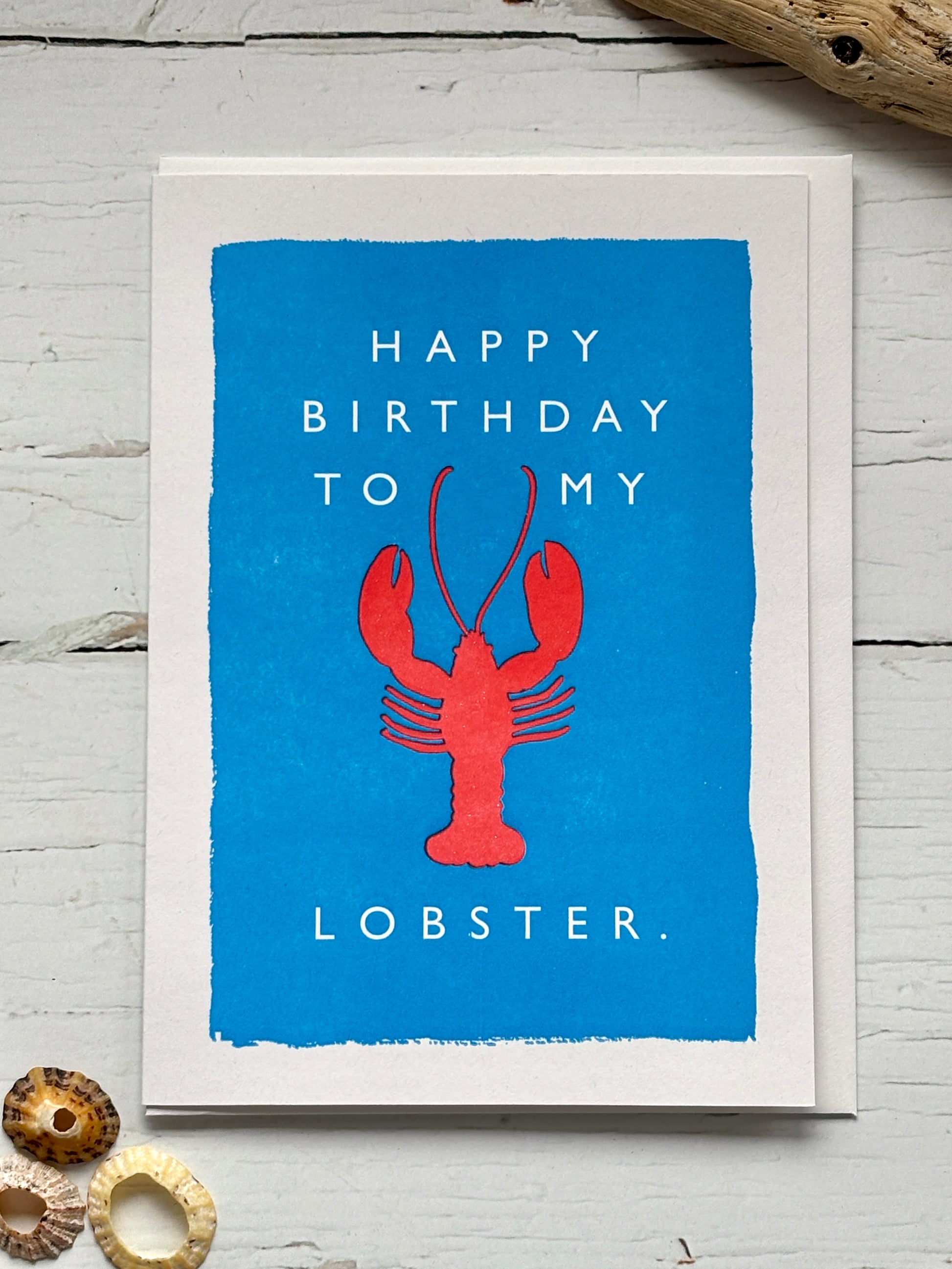 lobster birthday card—red lobster on blue with playful quote, ideal for romantic gifting and ocean-inspired celebrations