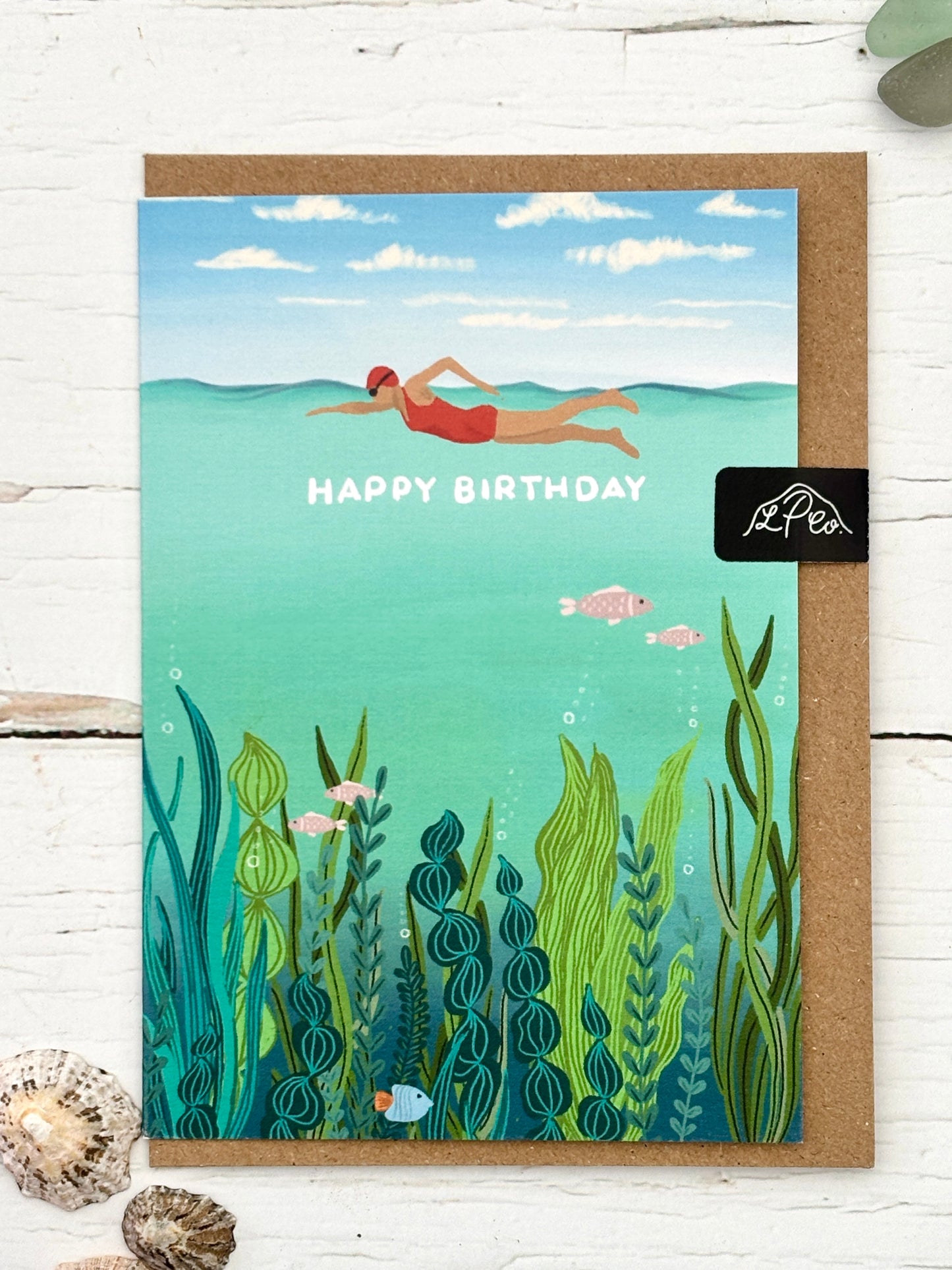 Happy Birthday card featuring an underwater painting of a sea swimmer in a red cap above colorful seaweed and fish coastal greeting card for swimmers