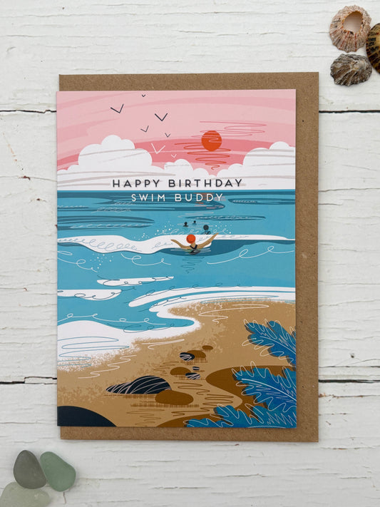 Happy Birthday Swim Buddy card featuring a stylized illustration of a sea swimmer in the ocean at sunset coastal greeting card for open water swimmers