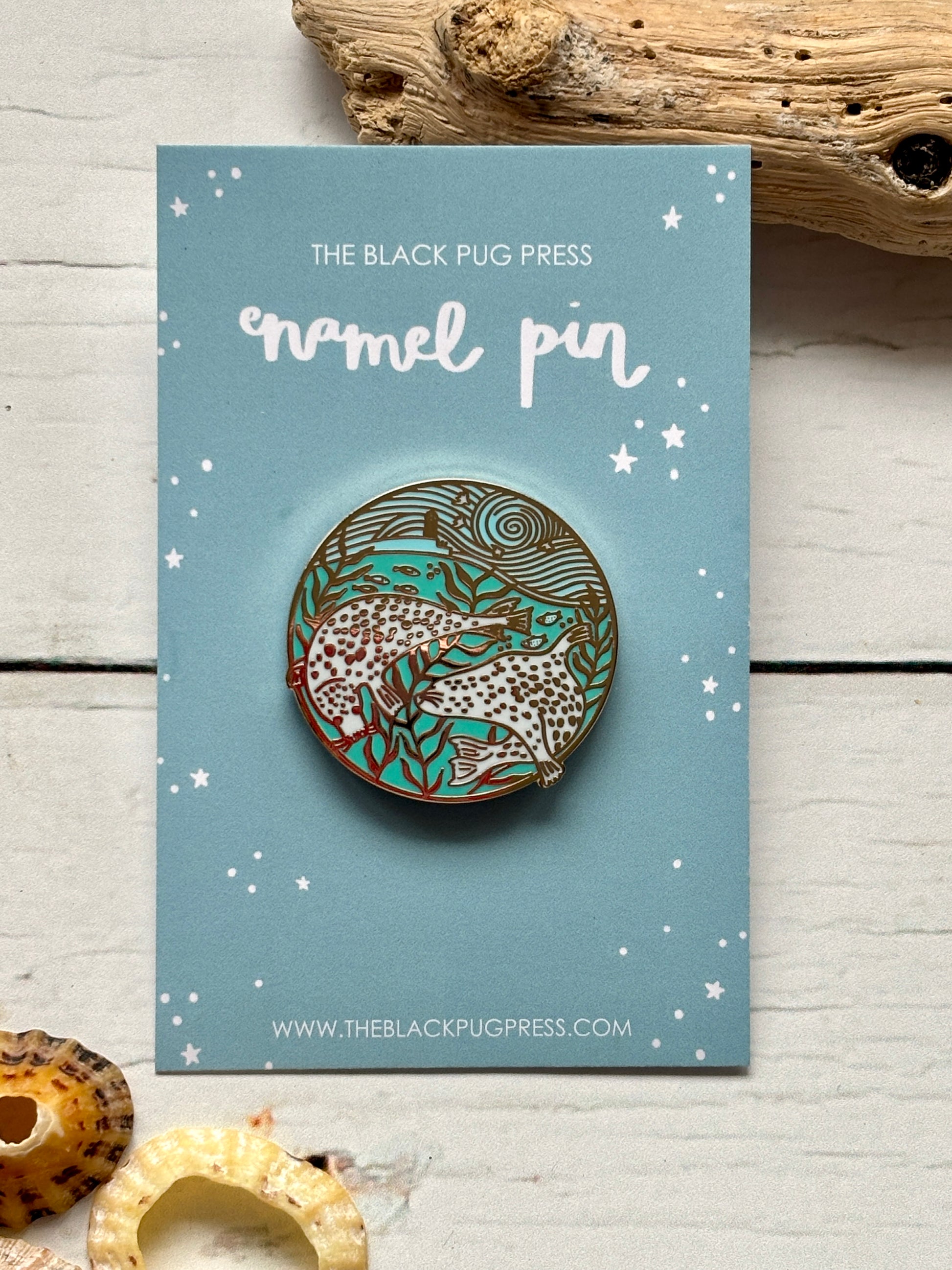 harbour seals enamel pin—two spotted seals in swirling seaweed, dreamy ocean scene for marine life and pin collectors