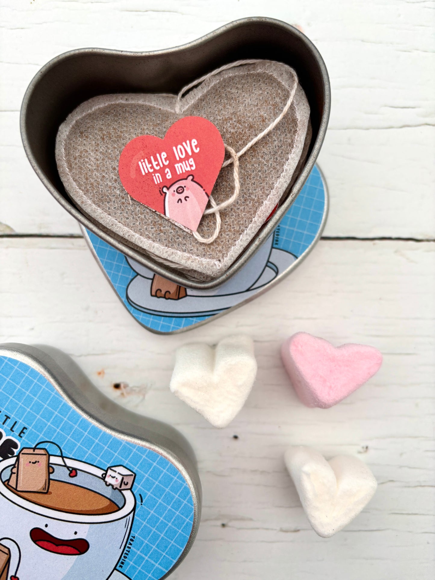 heart-shaped tea bag in illustrated tin—handmade Valentine’s gift with marshmallows, cozy charm, and cute packaging