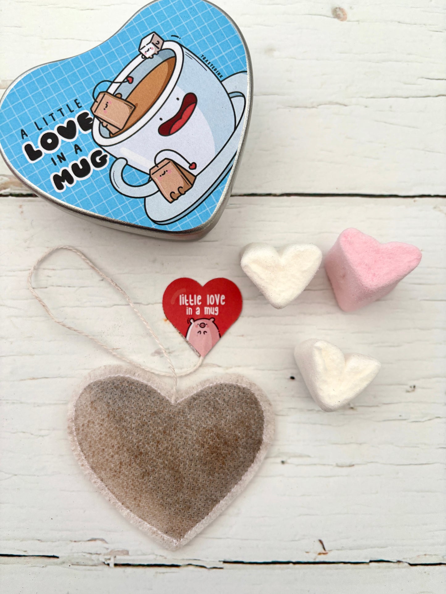 heart-shaped tea gift tin—cute illustrated mug, smiling tea bags, marshmallows, cozy Valentine’s treat