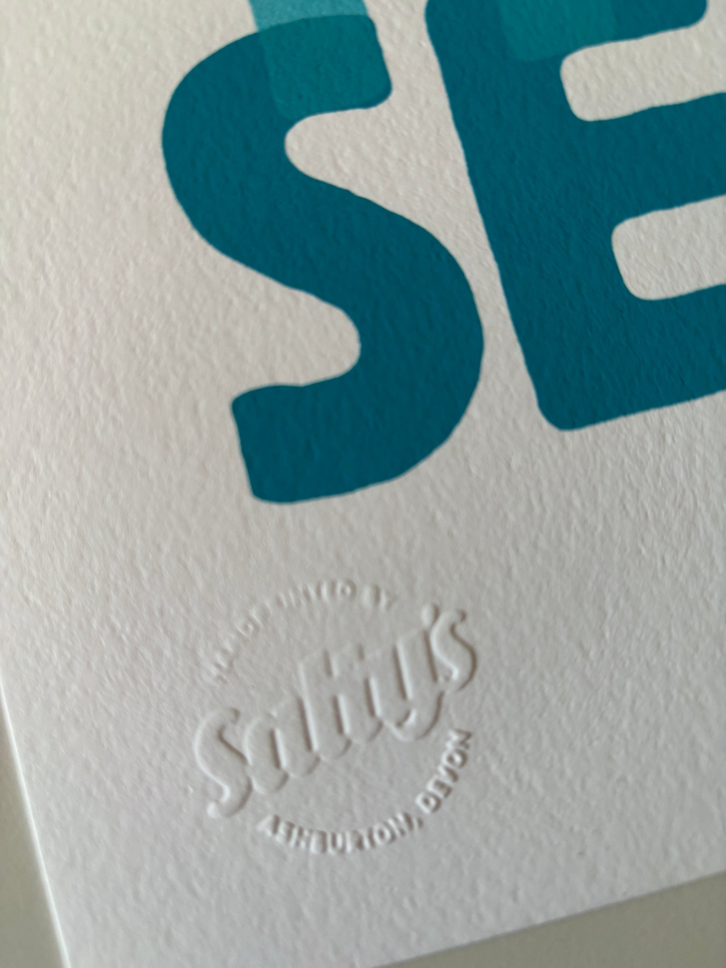 closeup shot of “I Can See the Sea” A4 print—hand-printed coastal wall art with embossed Salty’s Ashburton studio mark